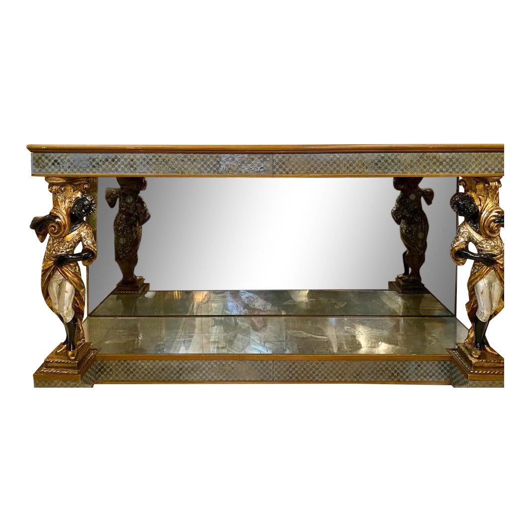 Hollywood Regency Maison Jansen figural and églomisé console table. This one of a kind simply stunning console table or sideboard has two drawers with églomisé fronts. The original mirrored tabletop is supported by a pair of magnificent flanking,