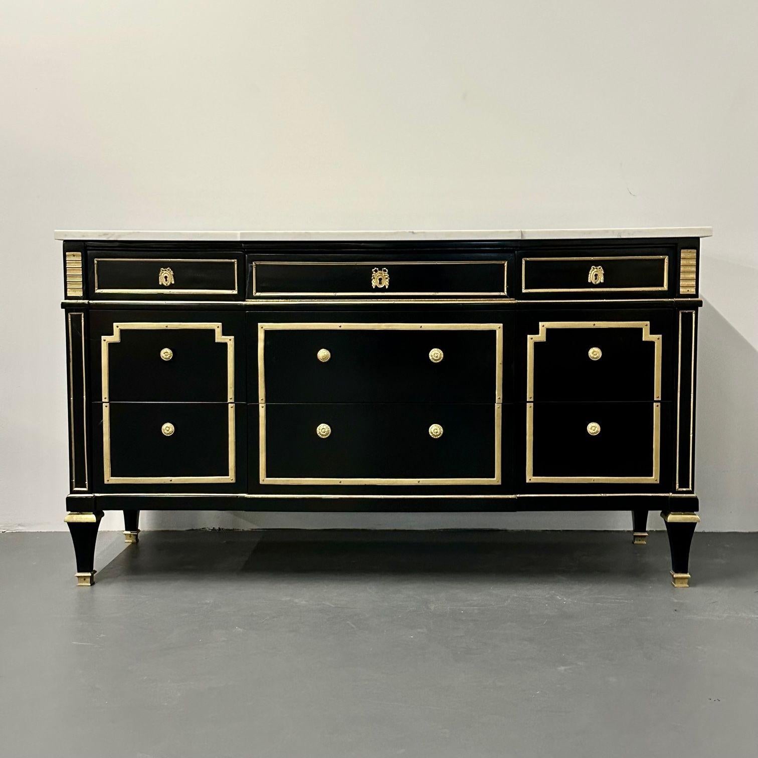 Hollywood Regency Jansen Style ebony commode / chest, marble top, bronze mounted, fully refinished. 
Nine drawer dresser having oak secondaries supporting a white and gray veined marble top. The case in a fine ebony finish with heavy wonderfully