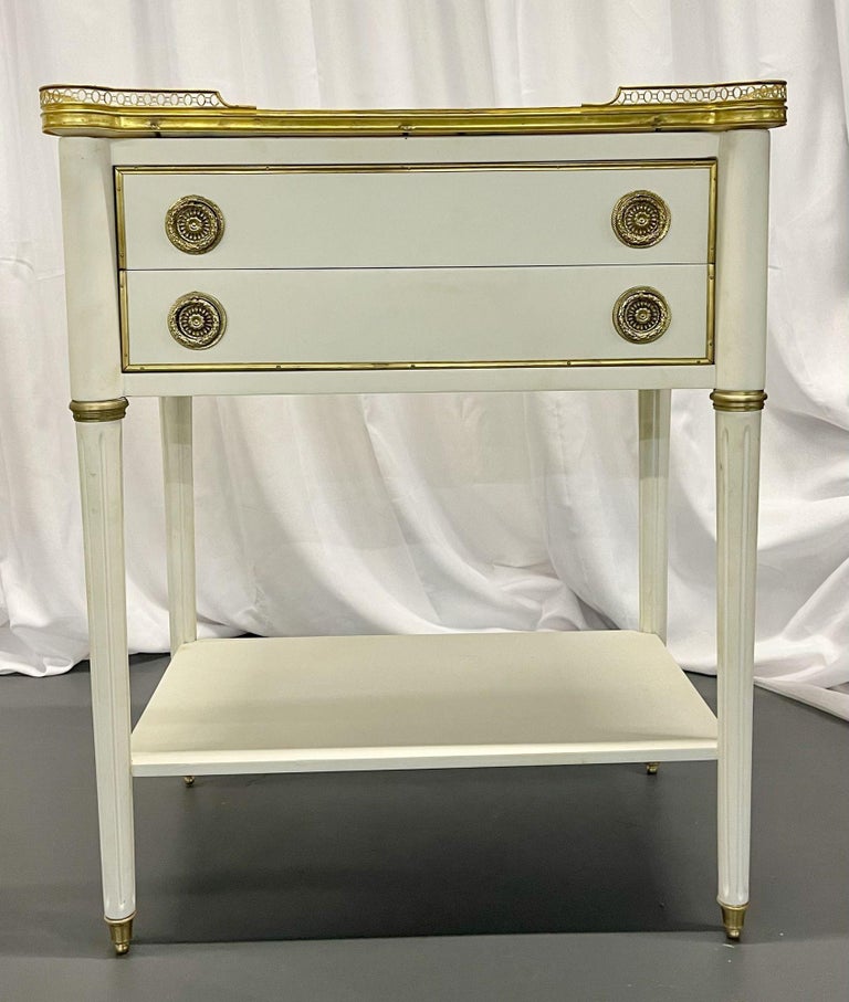 Hollywood Regency Jansen Styletwo drawer nightstands, end tables, bedside stands or side tables, bronze, marble, Louis XVI
 
A sleek and stylish pair of Maison Jansen Style Two Drawer Stands. Each having tapering bronze terminal caped legs on