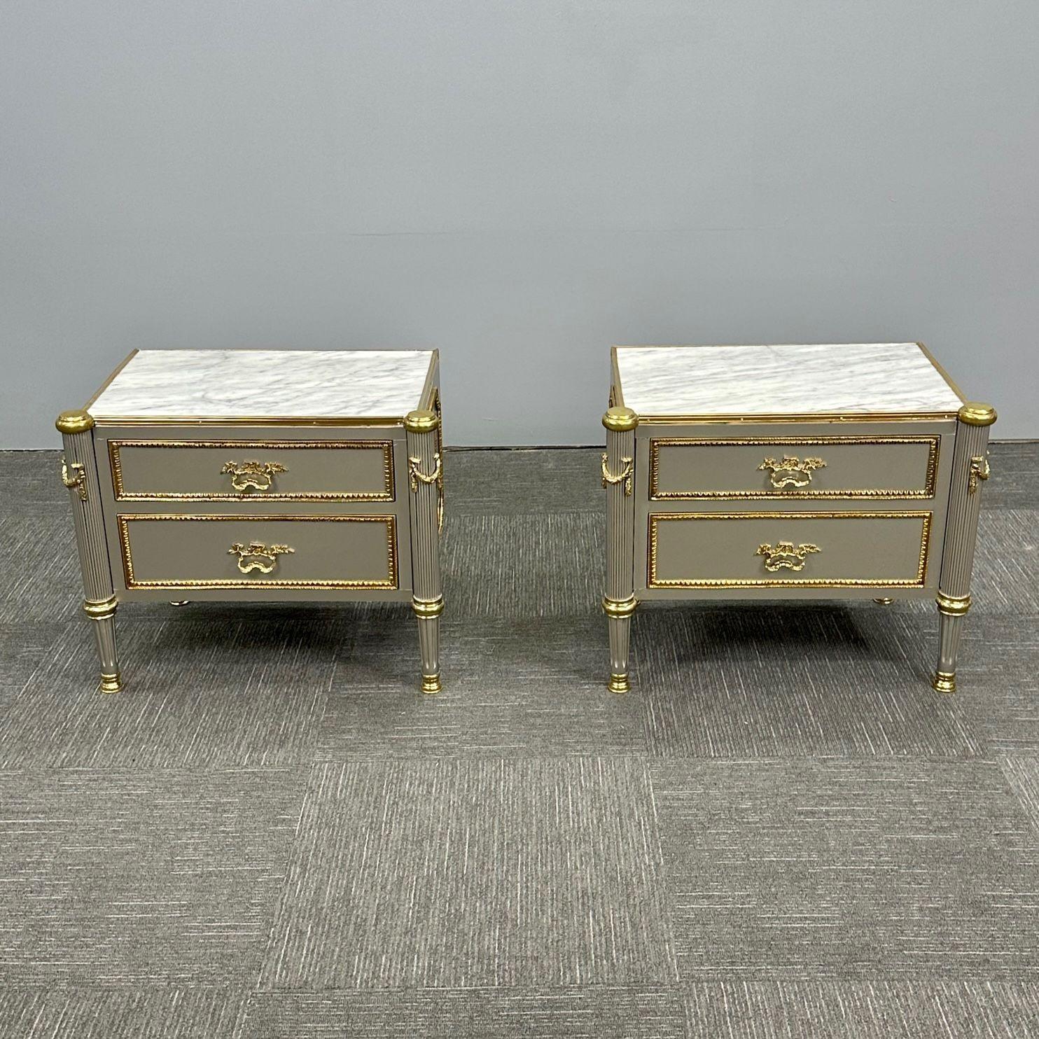 John Vesey Style, Hollywood Regency, Nightstands, Steel, Bronze, Marble, 2023
 
A stunning pair of finely produced end tables each having a white and gray veined marble top set in a bronze border supported by a wonderfully bronze mounted case having