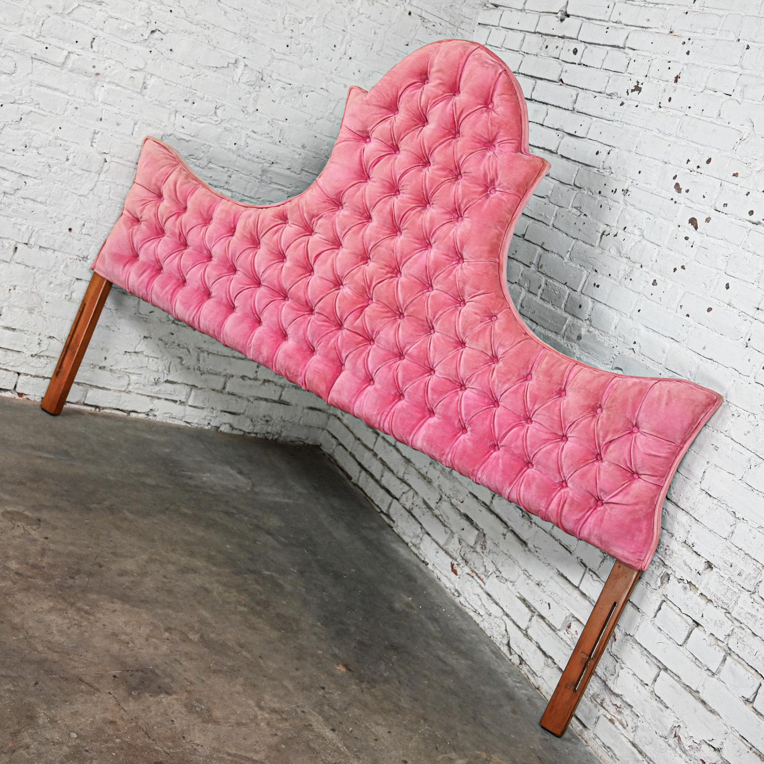 Gorgeous Mid to Late 20th Century Hollywood Regency king sized headboard button tufted pink velvet. Beautiful condition, keeping in mind that this is vintage and not new so will have signs of use and wear even if it has been refinished or restored.
