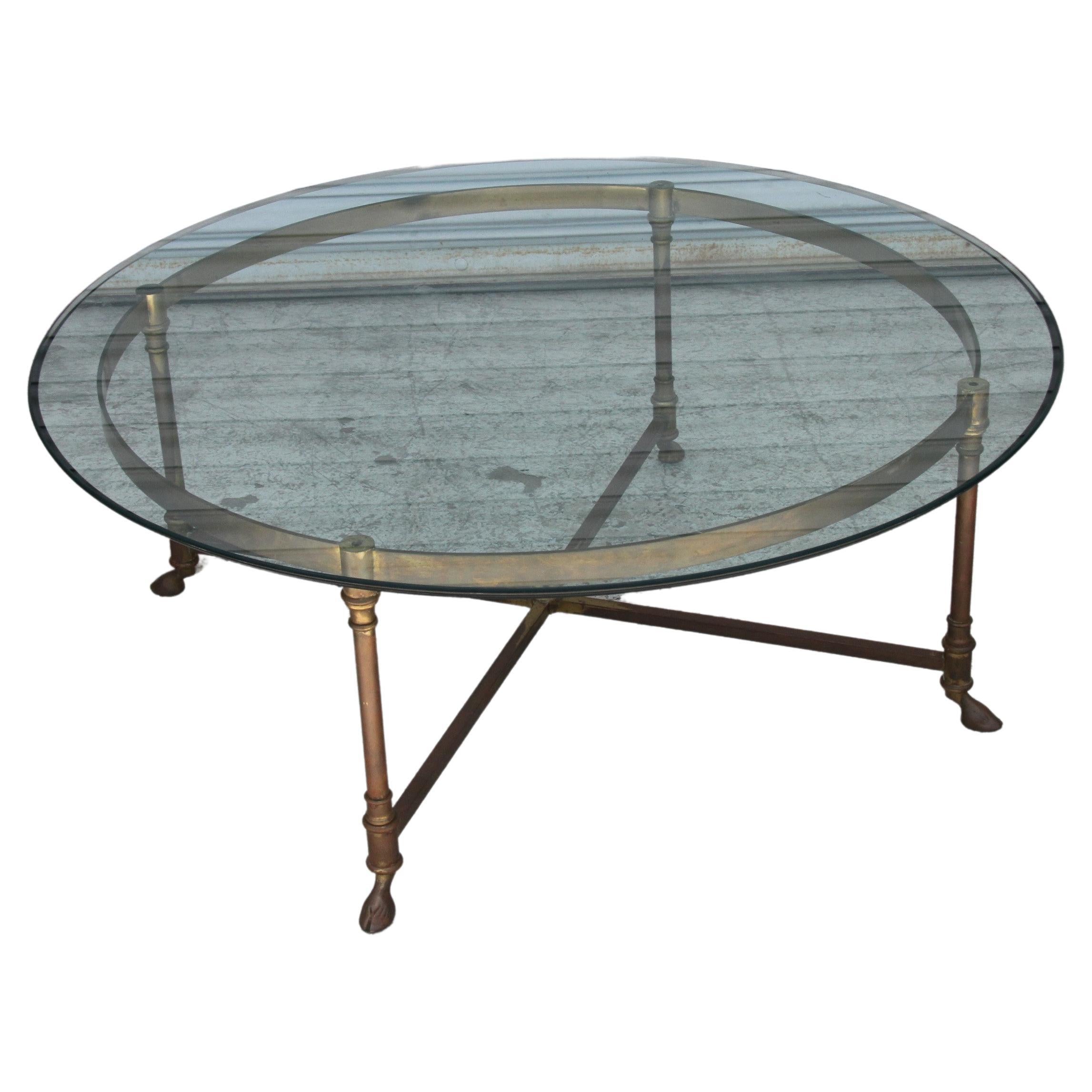 Hollywood Regency LaBarge Coffee Table

A brass circular coffee table with hoof feet and glass top attributed to La Barge. Original condition with natural patina on base.
36