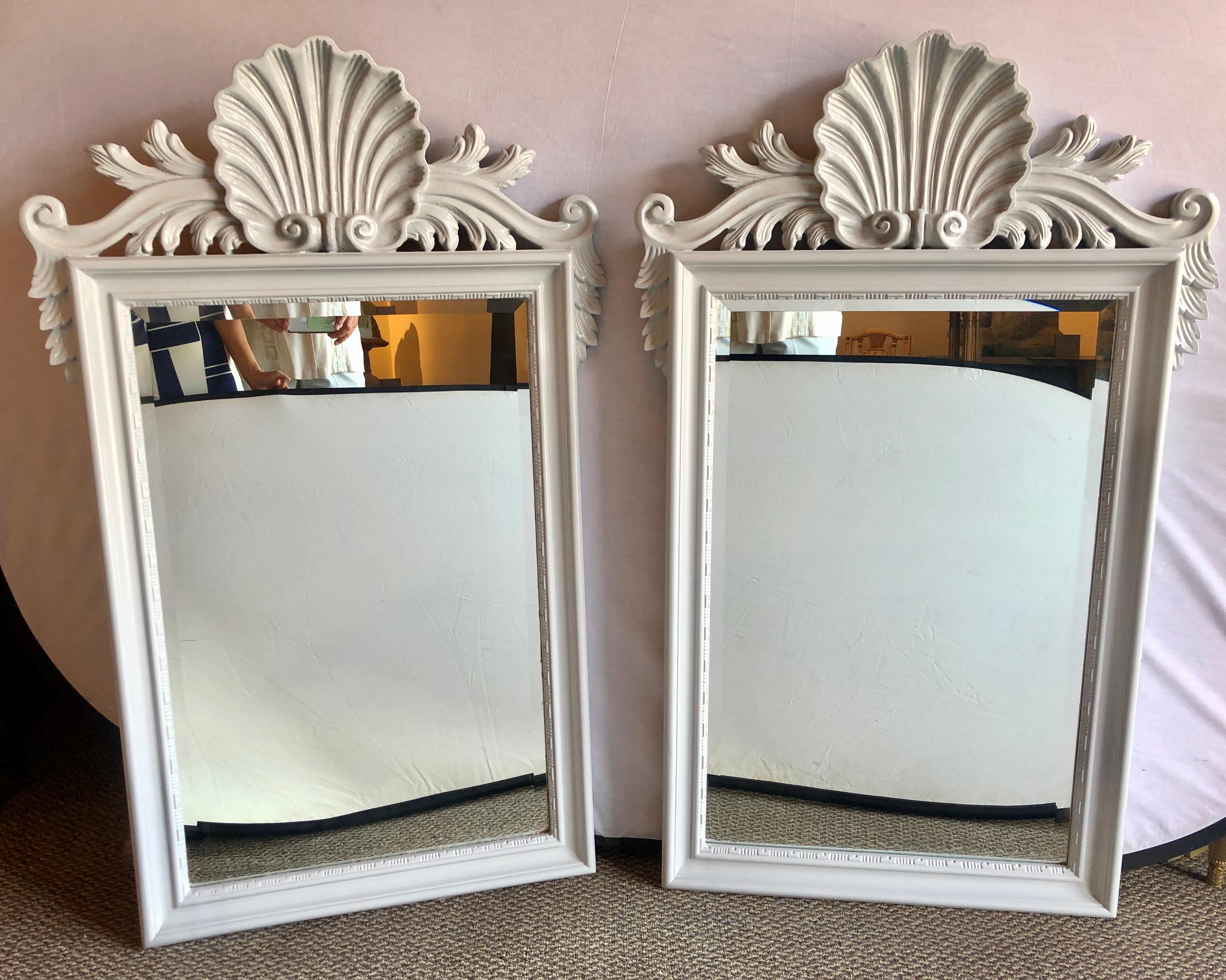 Pair of shell carved wall, pier of console mirrors in gray lacquered finish. These mirrors have been recently refinished in our state of the art workshops. The pair of Italian Labarge wall mirror with a large shell decorated top and rectangular wood