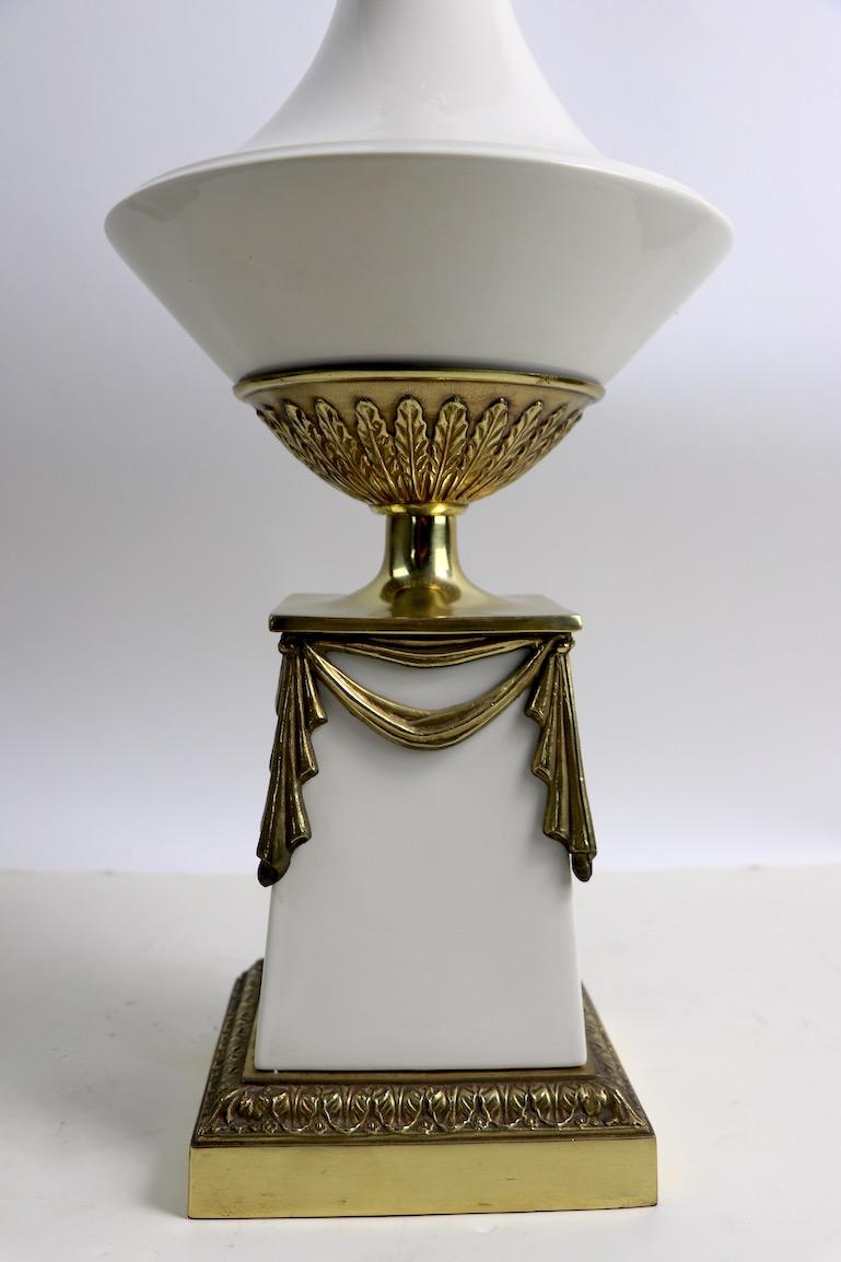 Very glamorous table lamp by Westwood Industries having a white porcelain body with decorative metal trim.
Very stylish statement lamp, with elegant, sophisticated design and style. Original, clean, working condition, shade  included, shade may show