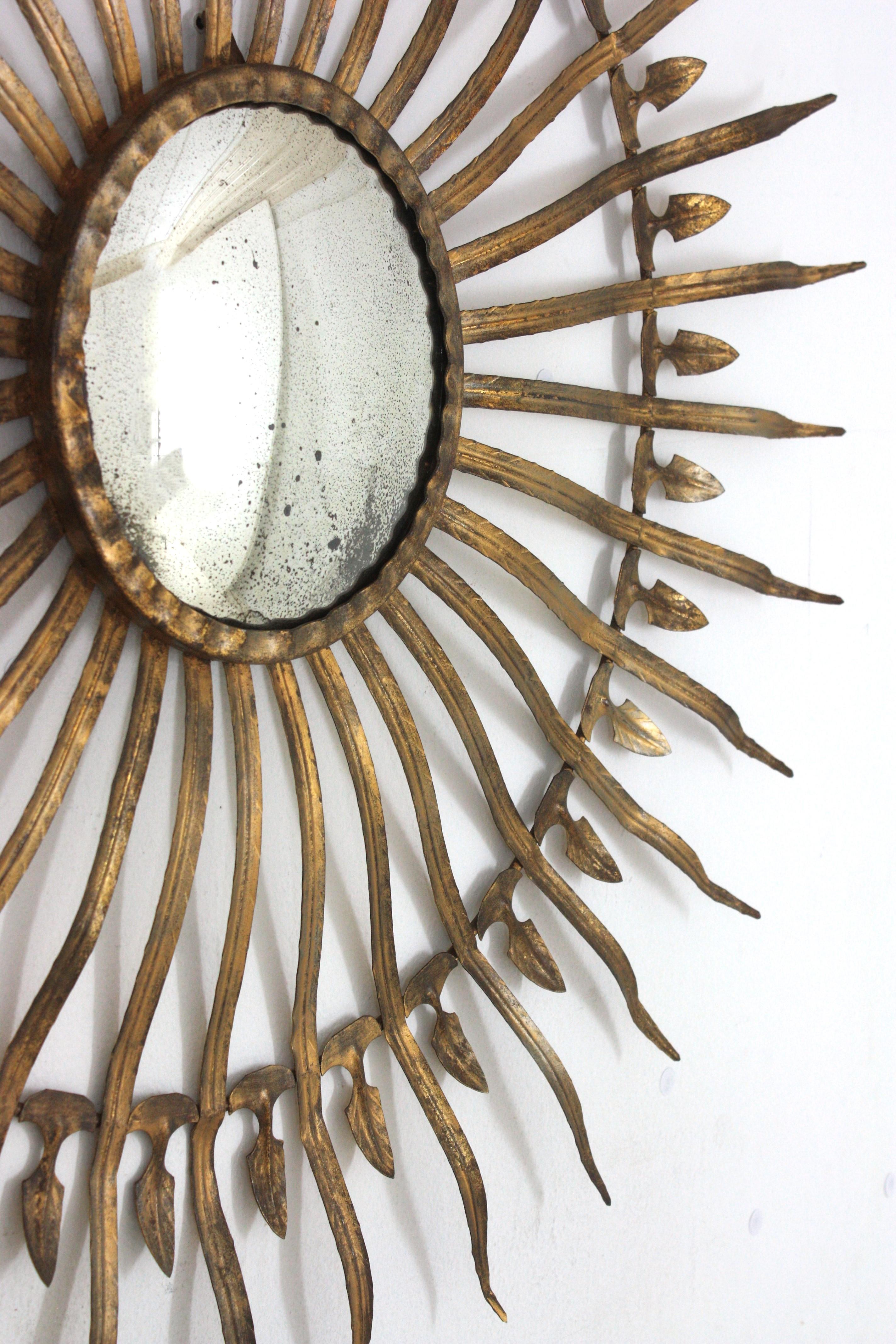 20th Century Hollywood Regency Large Convex Starburst Sunburst Mirror in Gilt Iron For Sale