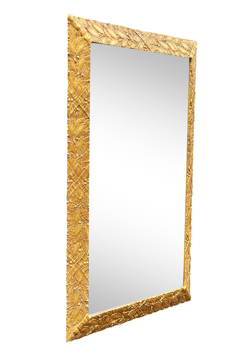 A beautiful large rectangular wall mirror from Italy circa 1960s. It features a carved wood gold gilt frame. In great ready to use condition.