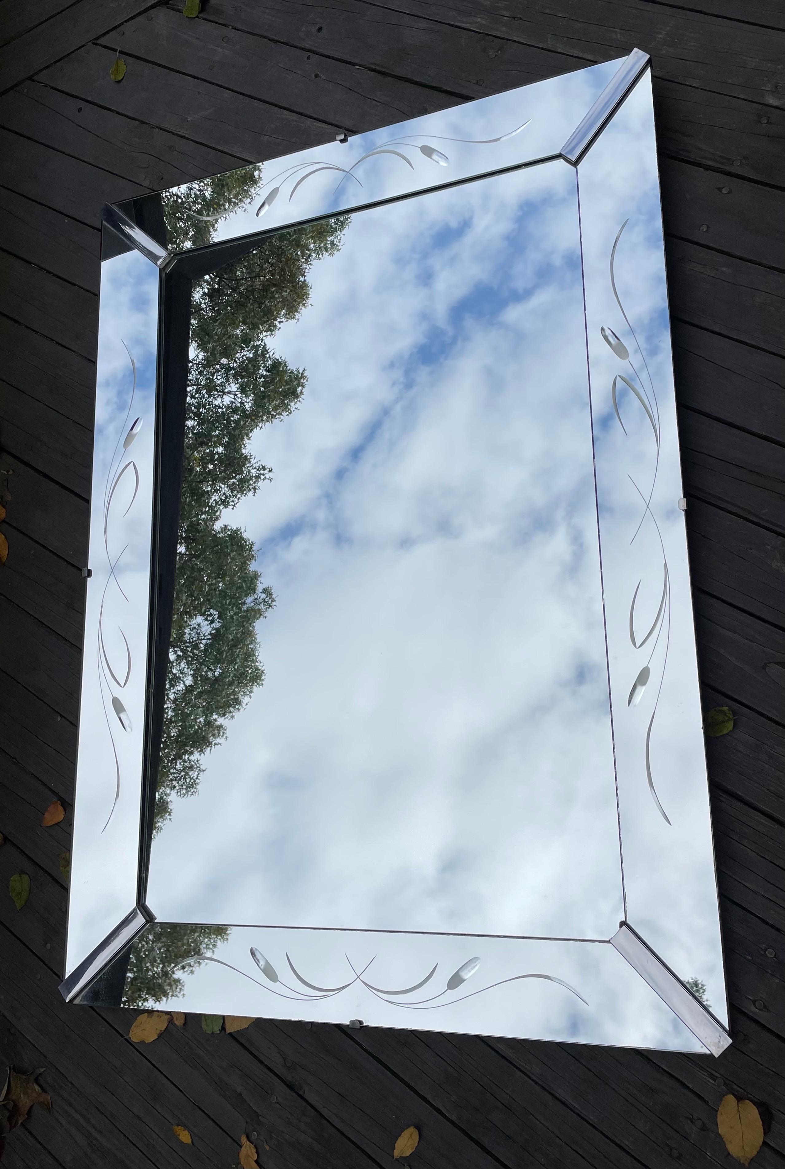 Beautiful Hollywood Regency period large scale rectangular mirror, tray frame with etched accents, 1950's.