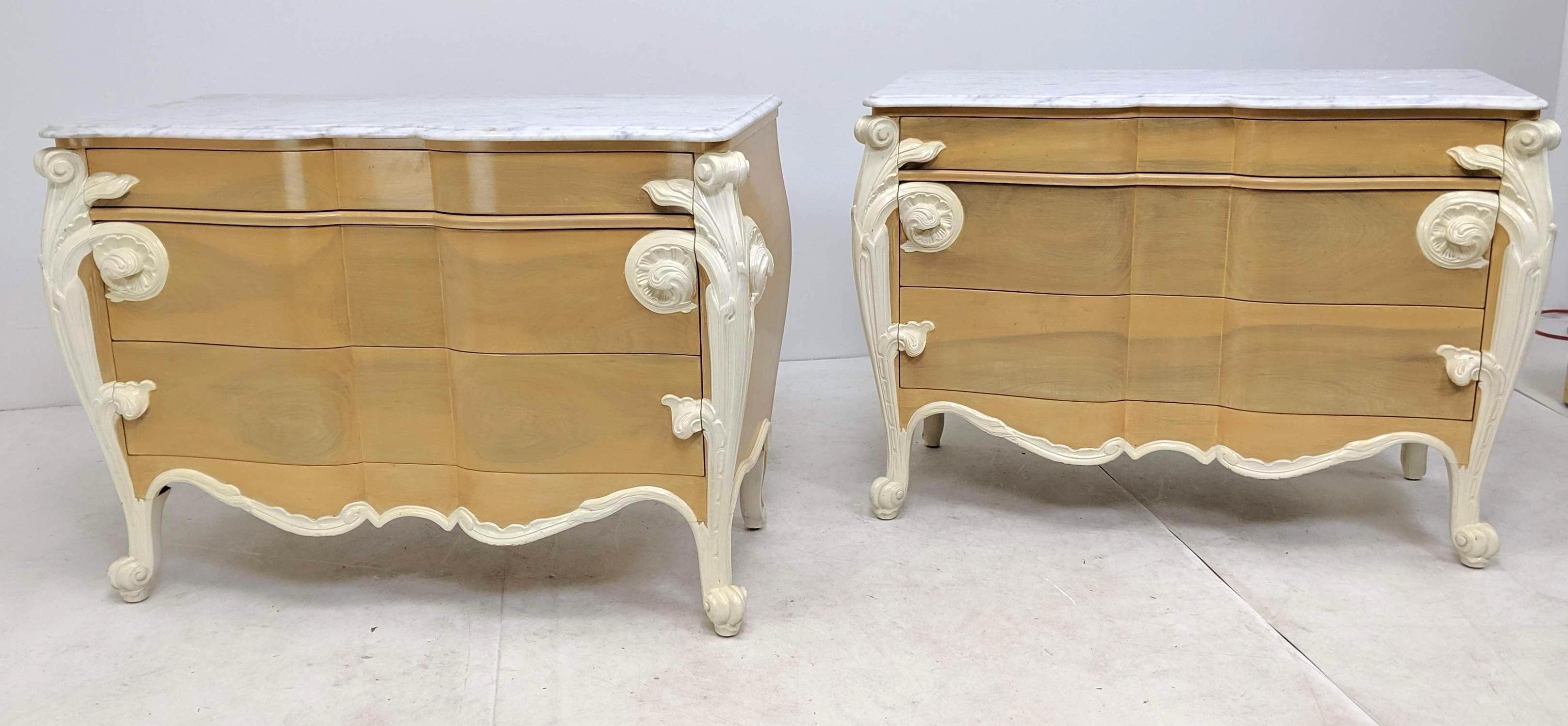 Casaragi marble-top commodes or dressers. Decorator French Louis XV style marble top bachelor chests bedside stands. Each having a white and gray veined marble top over three large serpentine drawers. Dressers having a rich carved Art Nouveau scroll