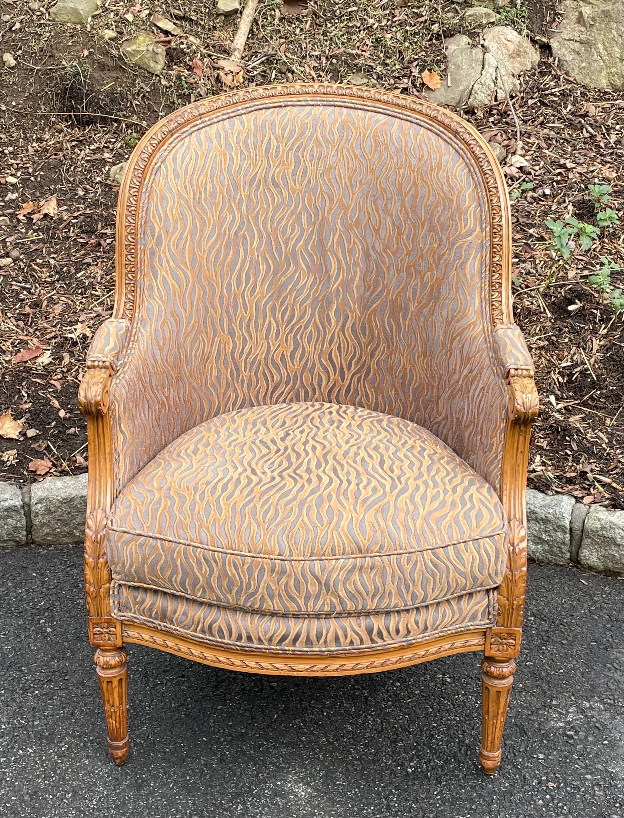 Louis XV style armchair with carved frame, upholstered in bronze flame patterned fabric.  No stains or rips in upholstery, minor wear on armrests, please see photos.