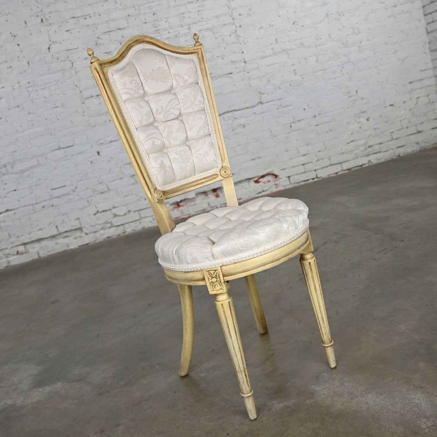 Beautiful French Provincial, Hollywood Regency, Louis XVI style antique white dressing or accent chair attributed to Prince Howard Furniture. It wears its original white brocade fabric. Wonderful condition, keeping in mind that this is vintage and