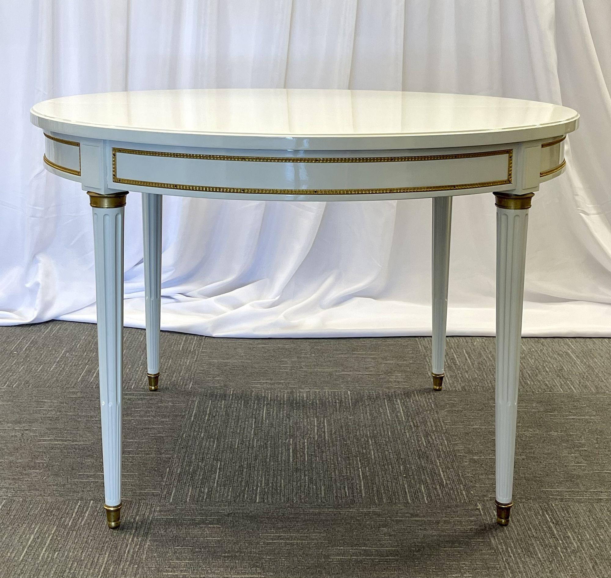 Hollywood Regency Louis XVI Style Dining Table, White Lacquer, Bronze, Jansen Style. Part of our extensive collection of over forty dining tables and chair sets as seen on this site, thus why we are referred to as the King of Dining rooms.
Fully