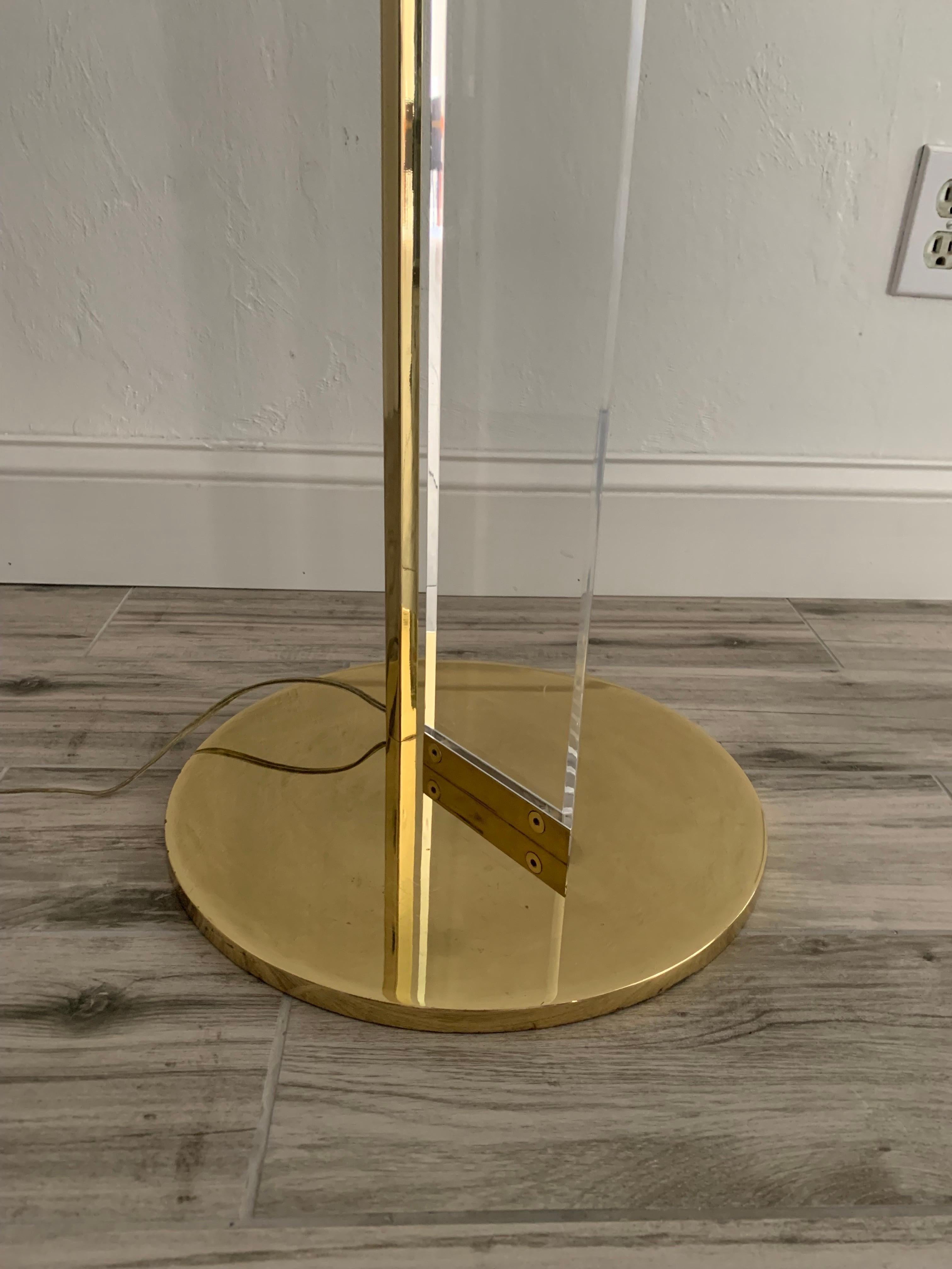 Brass and Lucite floor lamp by Fredrick Ramond. circa 1970s. 

In good vintage condition. Some light wear to brass base. 

Dimmer has been taken off the cord but a new one could be installed.