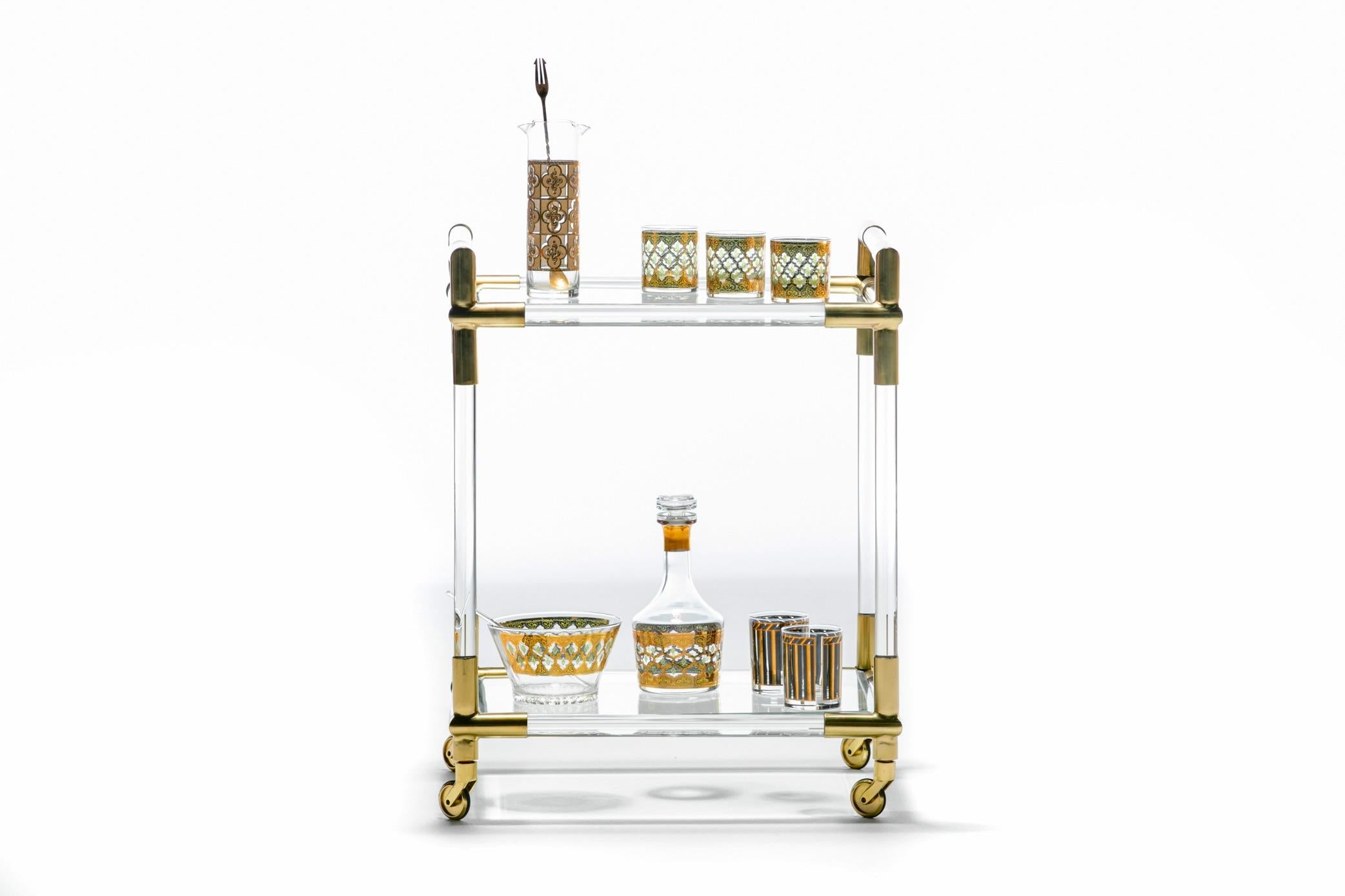 Strut into a chic home in Milan draped in gorgeous art and furnishings and you'd soon notice this beautiful Italian Lucite and Brass Bar Cart ready to serve afternoon cocktails in high style. Mamma mia! The look is chic. Sexy. Gucci. A sense of