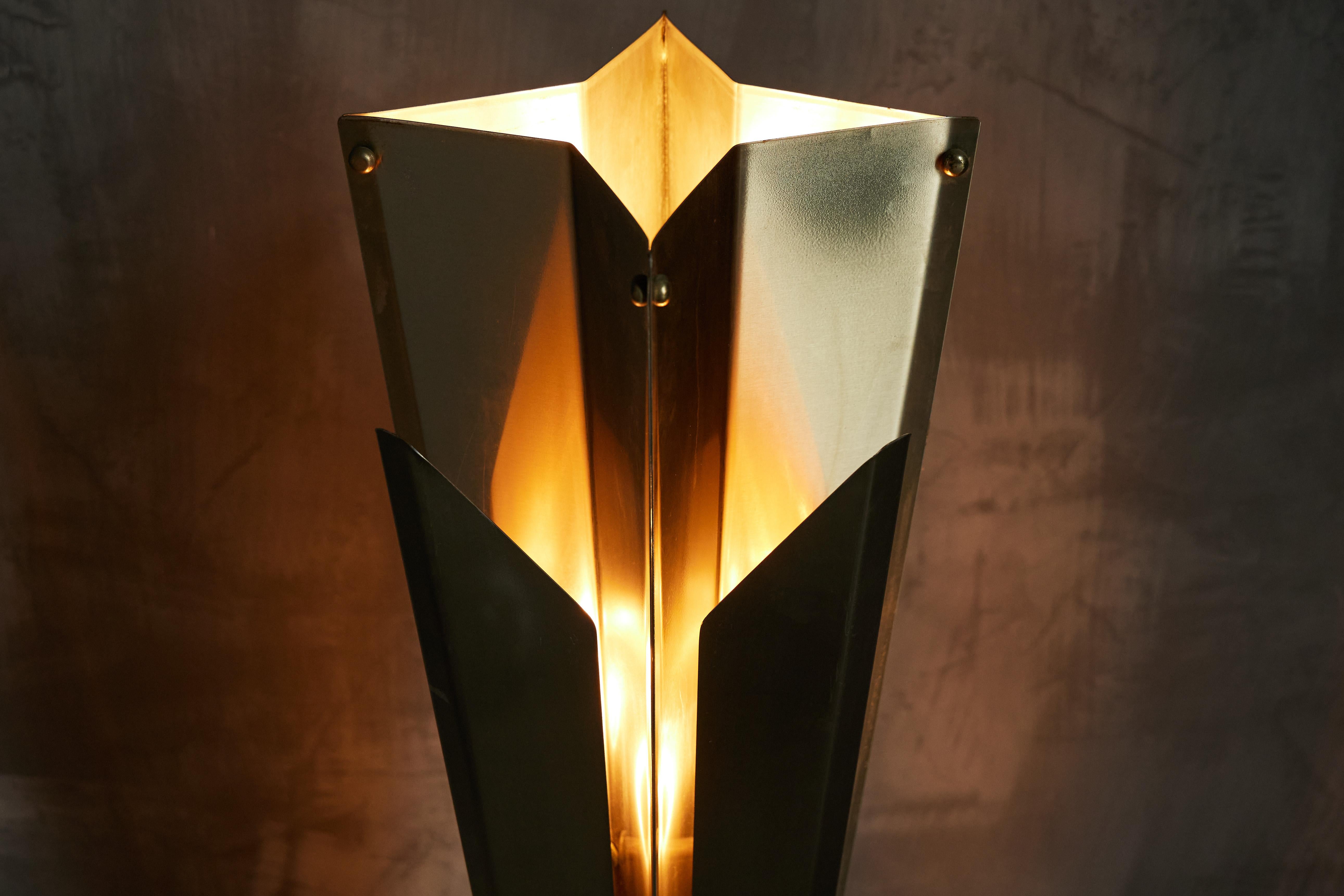Hollywood Regency Maison Charles star-shaped floor lamp, a masterpiece hailing from the glamorous 1960s in France. Crafted from gleaming silver metal, this exceptional lamp captures the essence of Hollywood's golden age with its striking star-shaped