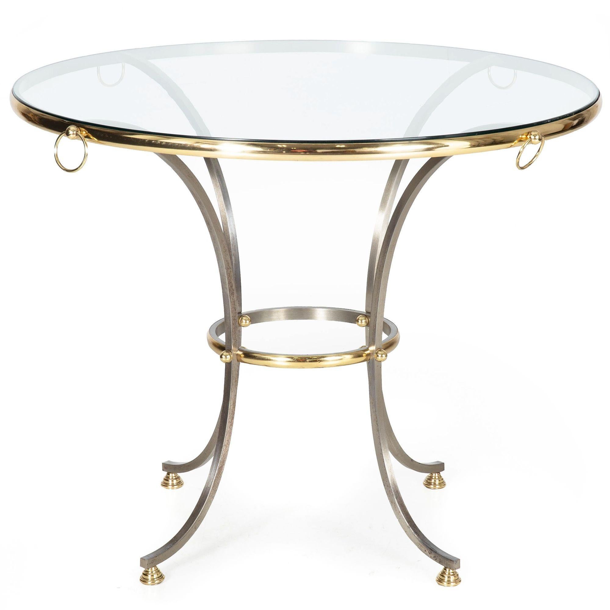 TABLE CIRCULAIRE HOLLYWOOD REGENCY EN LAITON POLI ET ACIER BROSSÉ

À la manière de la Maison Jansen, vers les années 1970

37