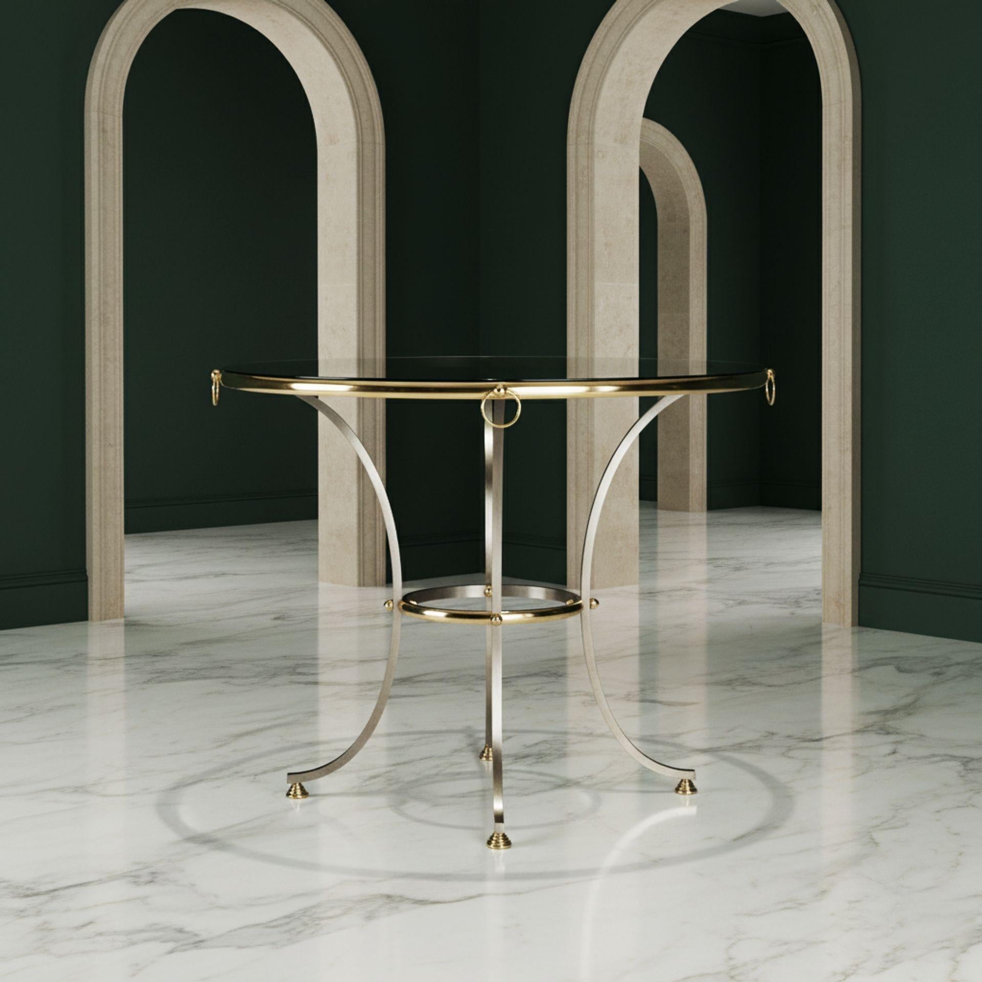 TABLE CIRCULAIRE HOLLYWOOD REGENCY EN LAITON POLI ET ACIER BROSSÉ

À la manière de la Maison Jansen, vers les années 1970

37