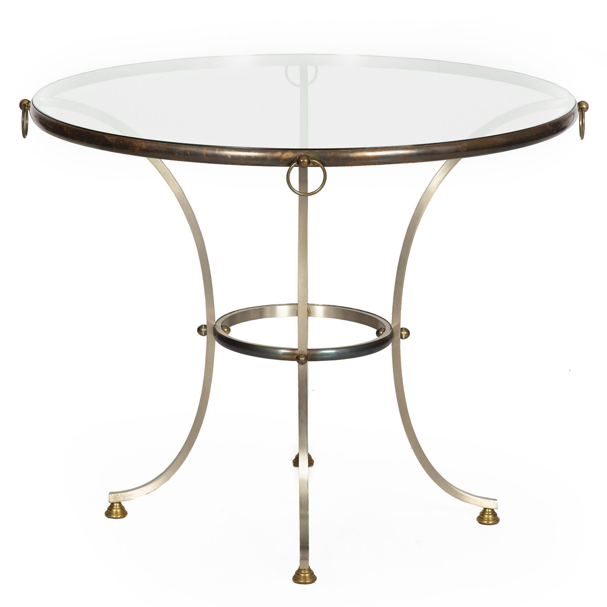 




HOLLYWOOD REGENCY BRUSHED STEEL, BRONZE, BRASS AND GLASS CENTER TABLE
Probably Italian circa 1970s  manner of Maison Jansen  unmarked
Item # 311XGP10P
An absolutely gorgeous vintage Hollywood Regency style circular center table, it features a
