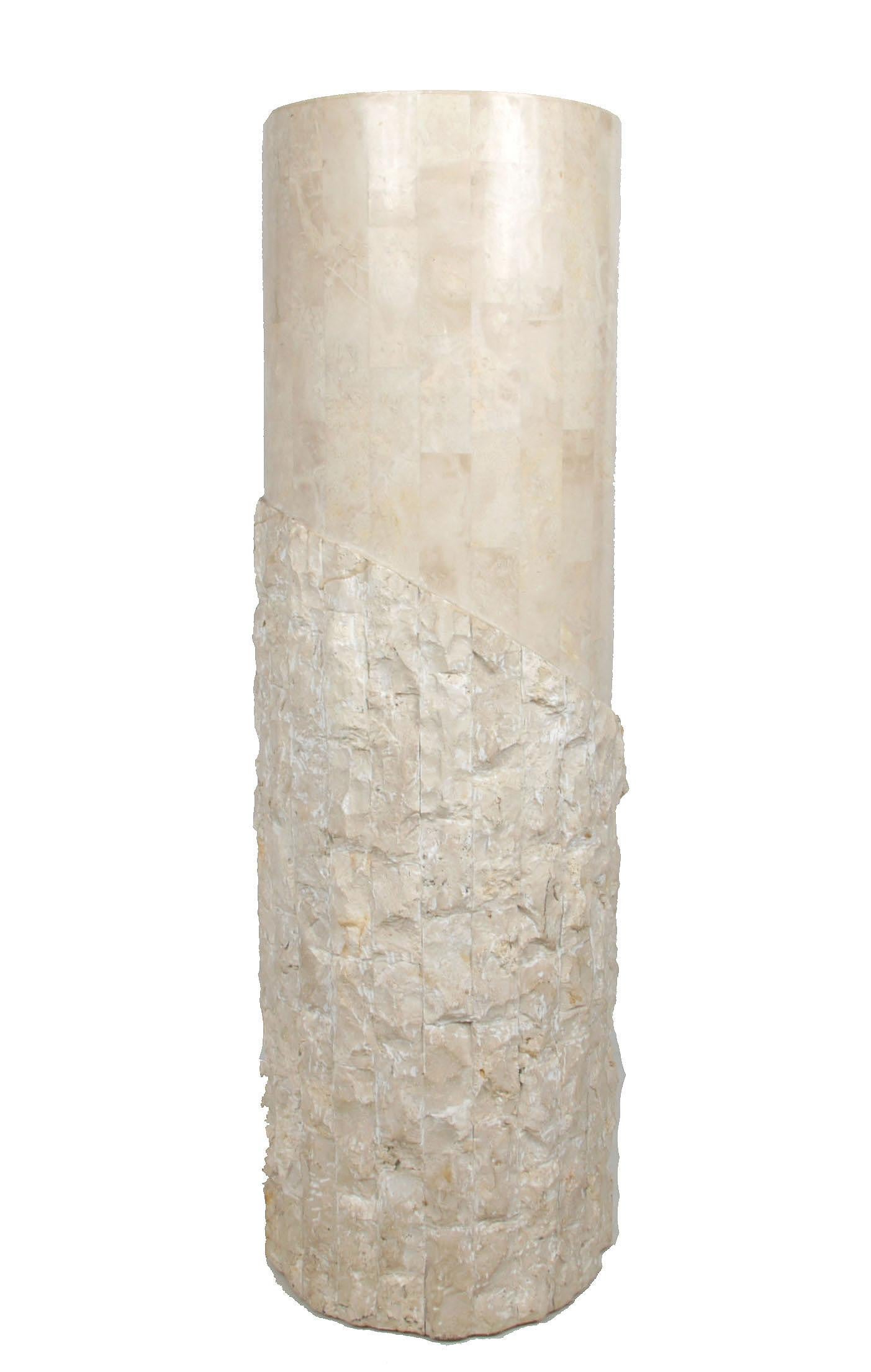Hollywood Regency Maitland-Smith tessellated stone over wood pedestal.
Smooth texture around the top and chiseled stone at the bottom makes this pedestal so interesting. 
Stunner done and useful to display your favorite pieces of art.
 
