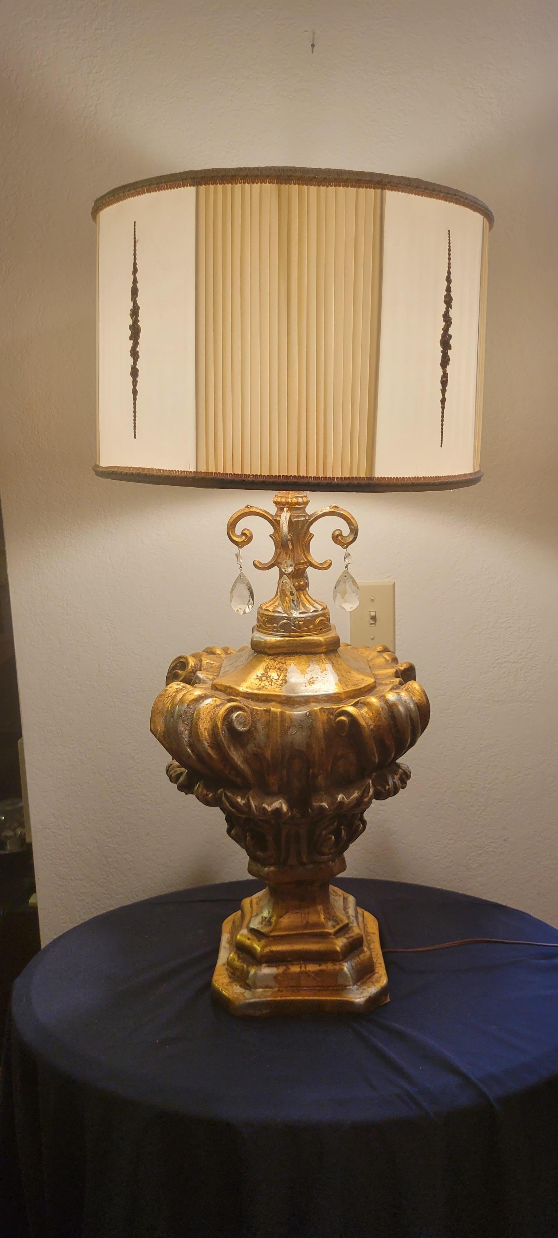 This Mid-Century-Modern Hollywood Regency parlor lamp is about 36 inch high. The metal base has an antiqued gold finish and measures 9