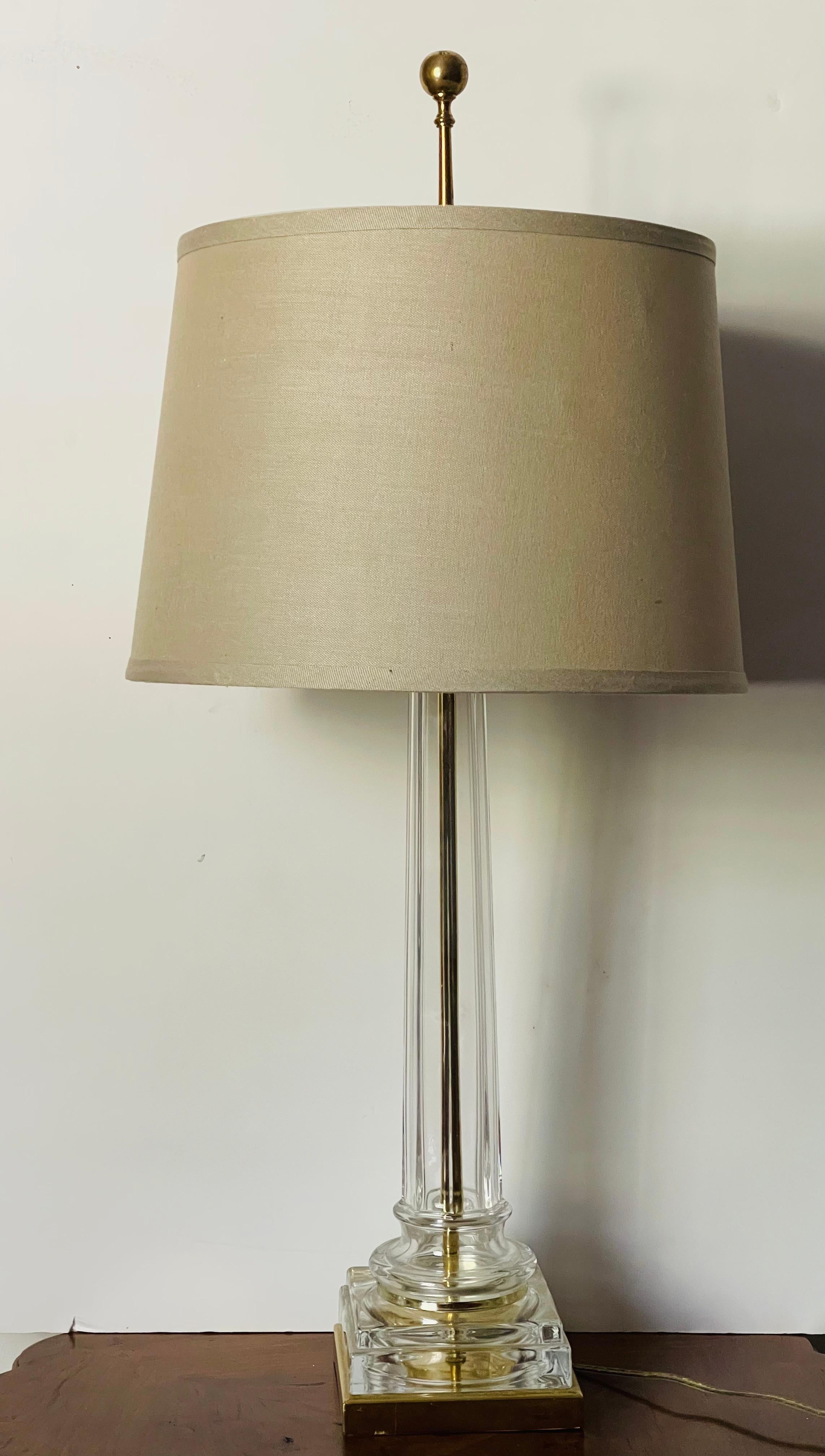 Elegant Hollywood Regency Mid Century Modern glass  Lamp on a brass plinth.31” high.