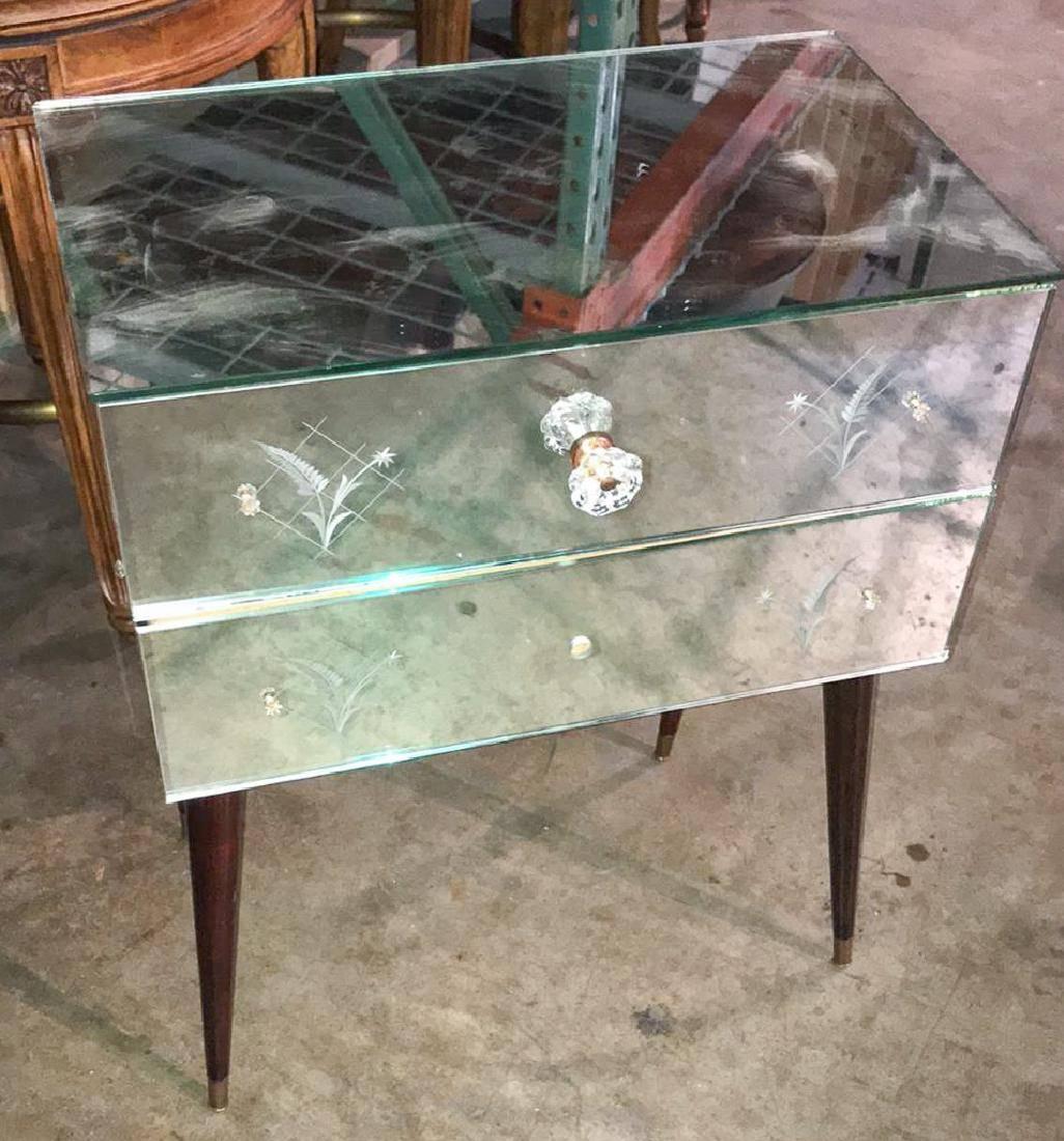 Rare Hollywood Regency Mid-Century Modern two-drawer nightstand or end table, mirrored and etched. The entire on turned and tapered legs,

circa 1960.

Good condition. Minor chipping to mirror edges. Missing one pull.