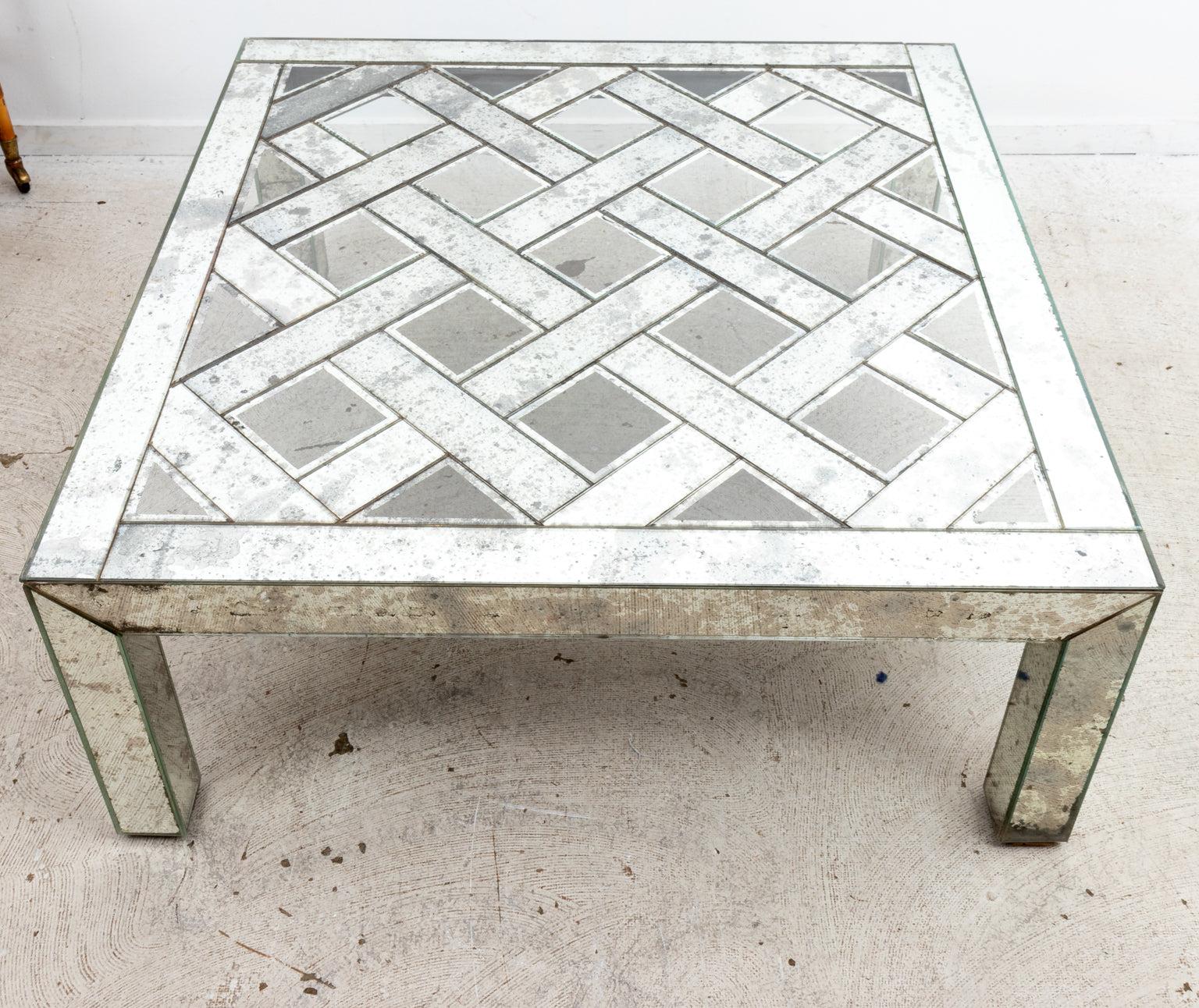 Hollywood regency mirrored glass coffee table, with a beveled glass Panels in a cross hatch design . 
