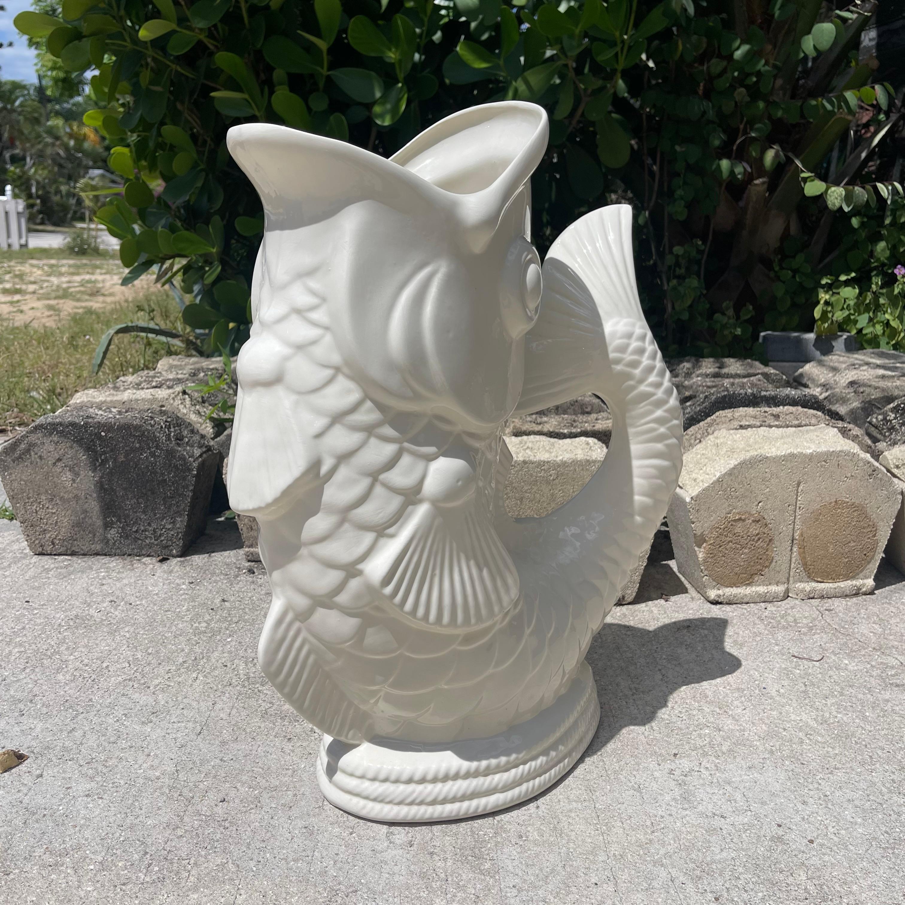 Whimsical umbrella stand in the form of a mythical dolphin, often mistaken as a koi fish. 