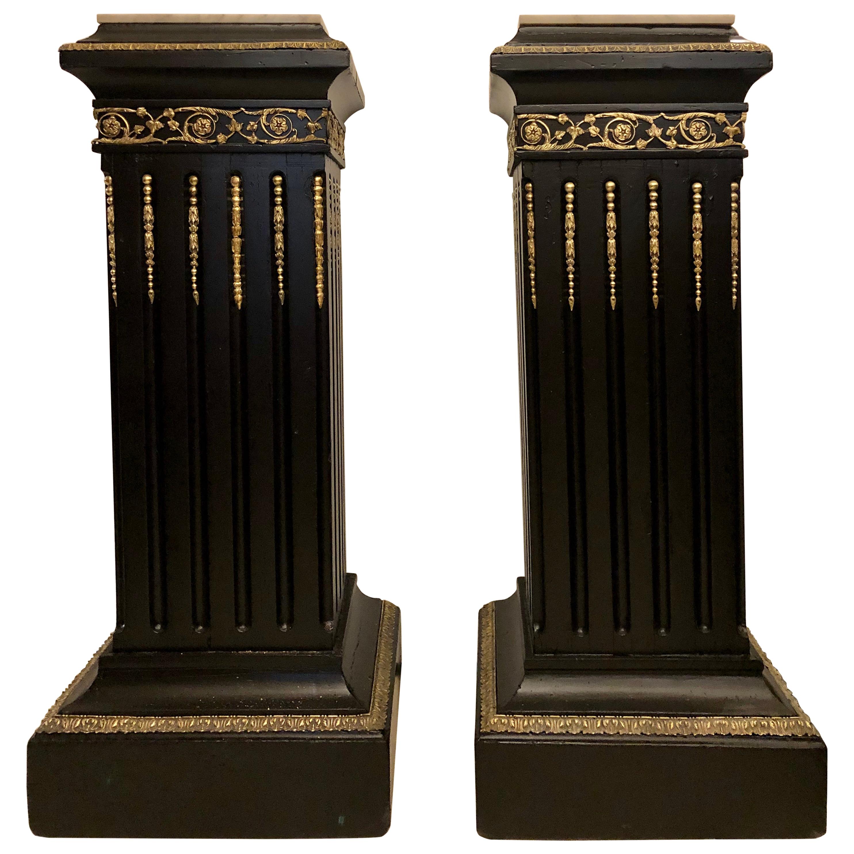 Hollywood Regency Neoclassical Ebony Pedestals, Bronze Mounted Marble Tops, Pair For Sale