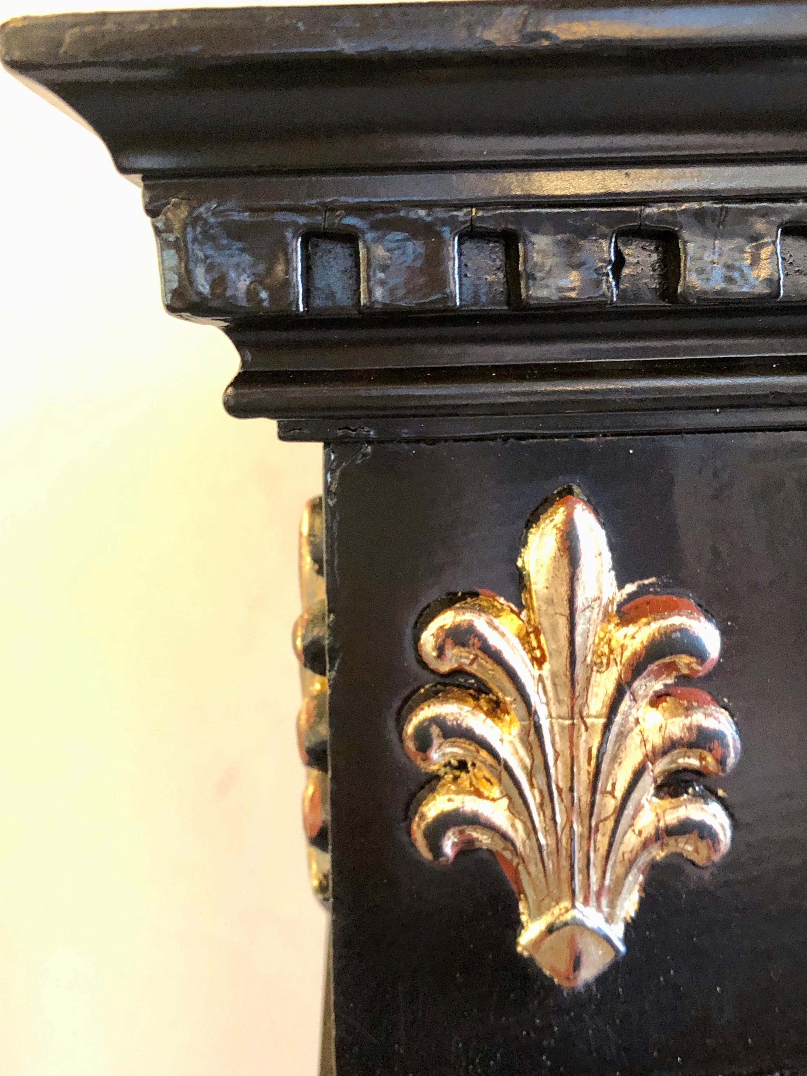 20th Century Hollywood Regency Neoclassical Style Pedestal Ebonized and Parcel Gilt Decorated
