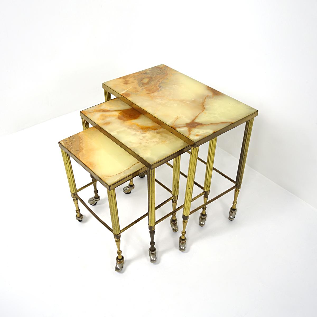 Dutch Hollywood Regency Nesting Tables on Wheels Made of Brass With Marble Tops For Sale