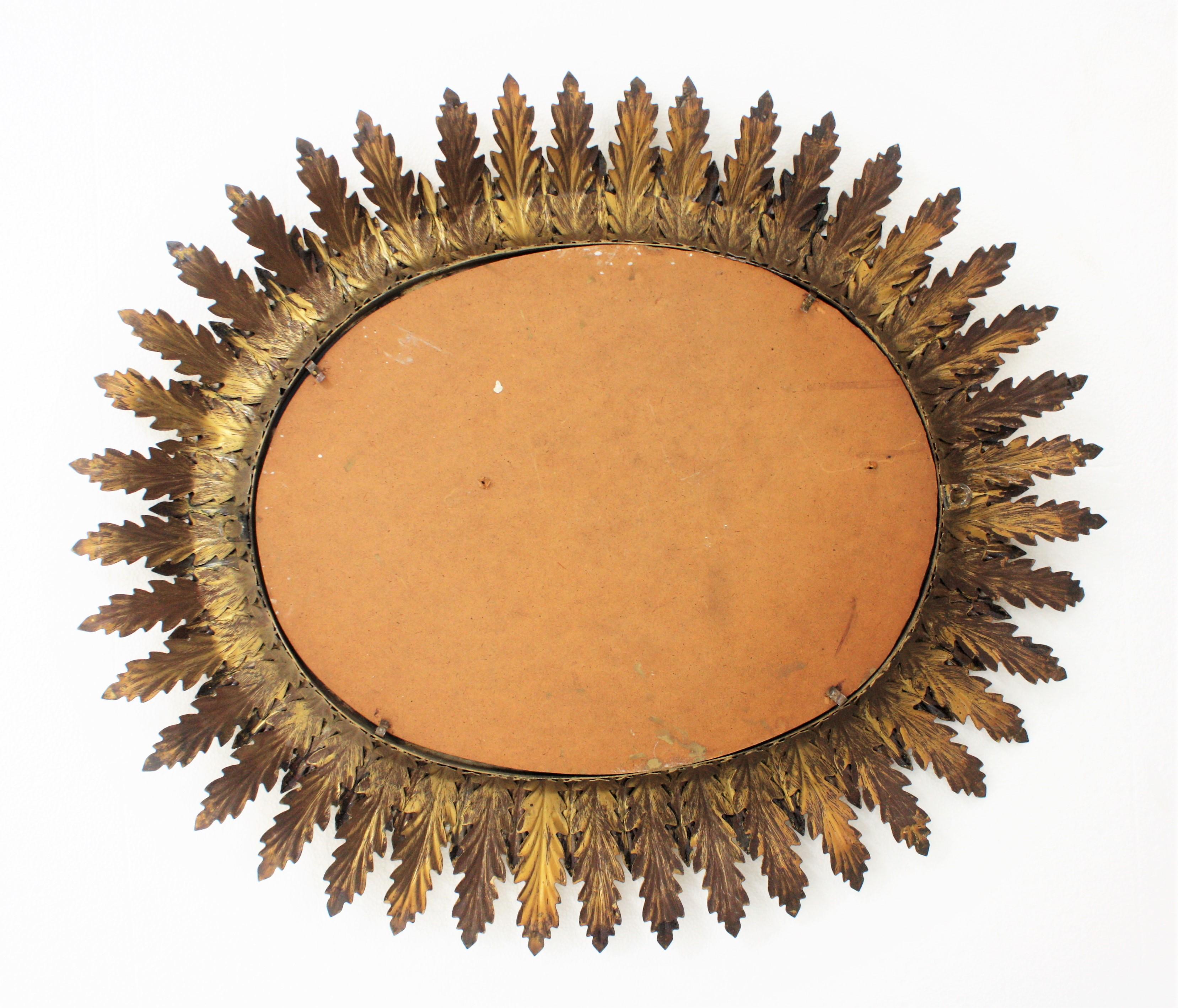 Hollywood Regency Oval Gilt Metal Leafed Sunburst Mirror, Spain, 1950s 5