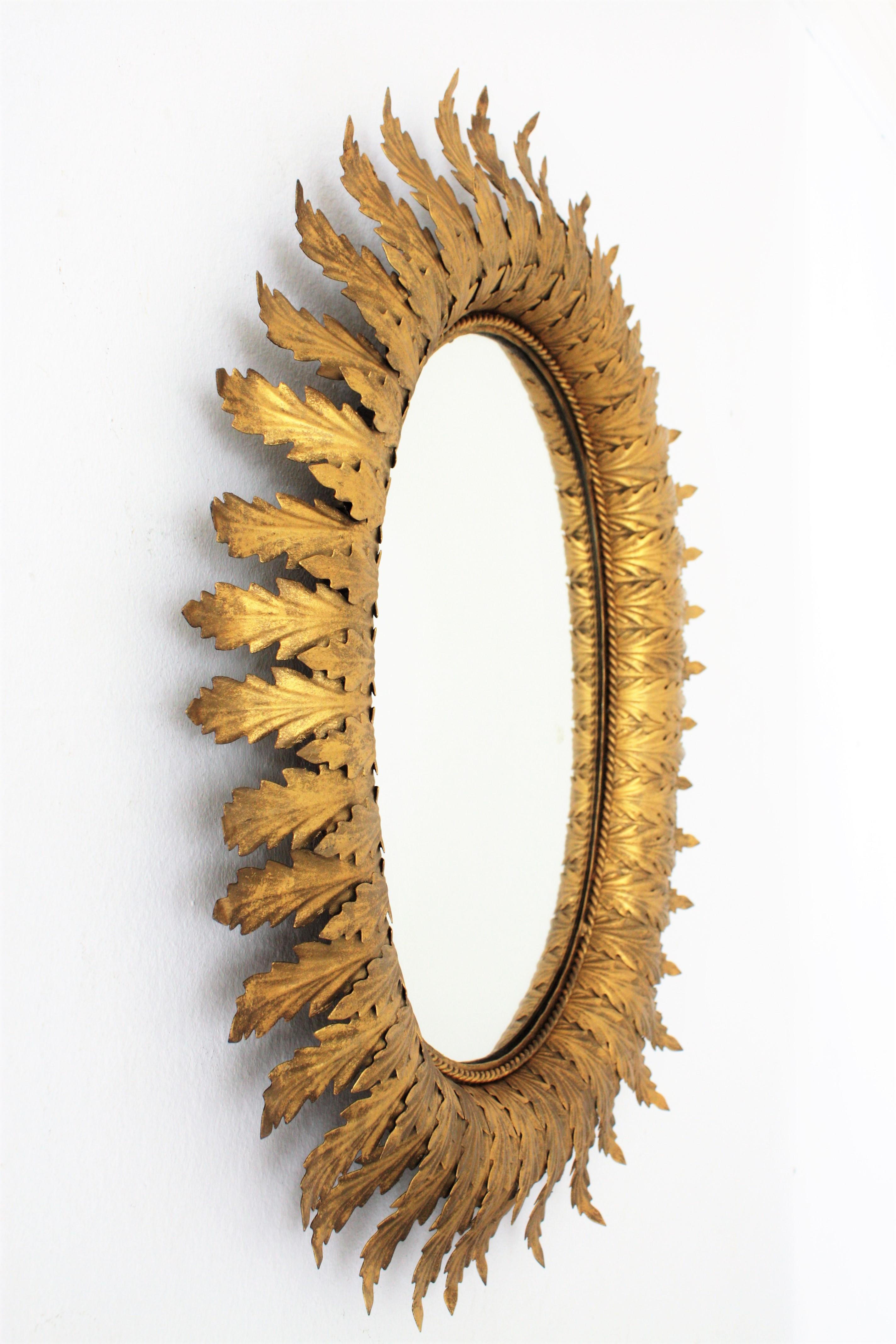 Hollywood Regency Oval Gilt Metal Leafed Sunburst Mirror, Spain, 1950s In Excellent Condition In Barcelona, ES