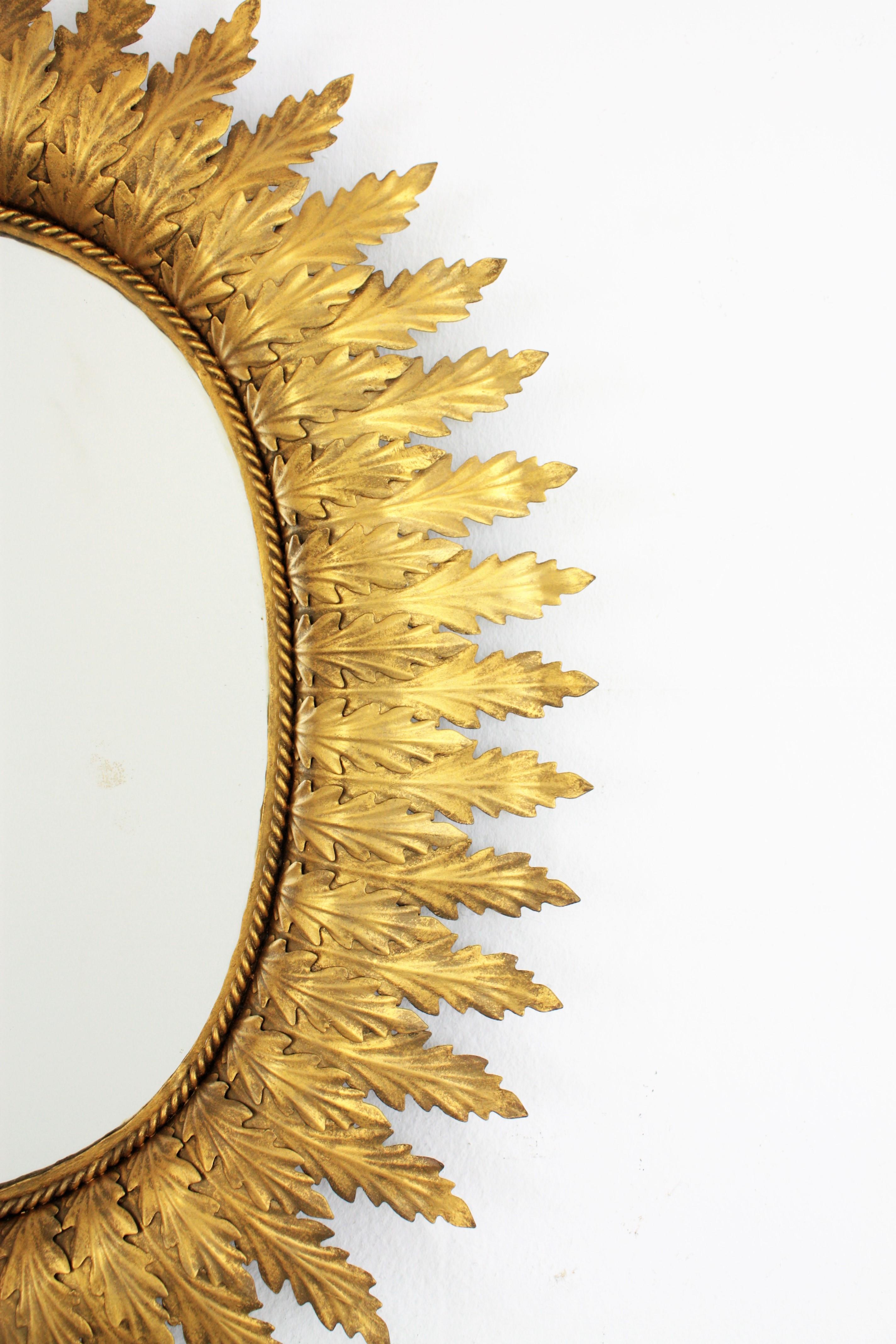 Hollywood Regency Oval Gilt Metal Leafed Sunburst Mirror, Spain, 1950s 1