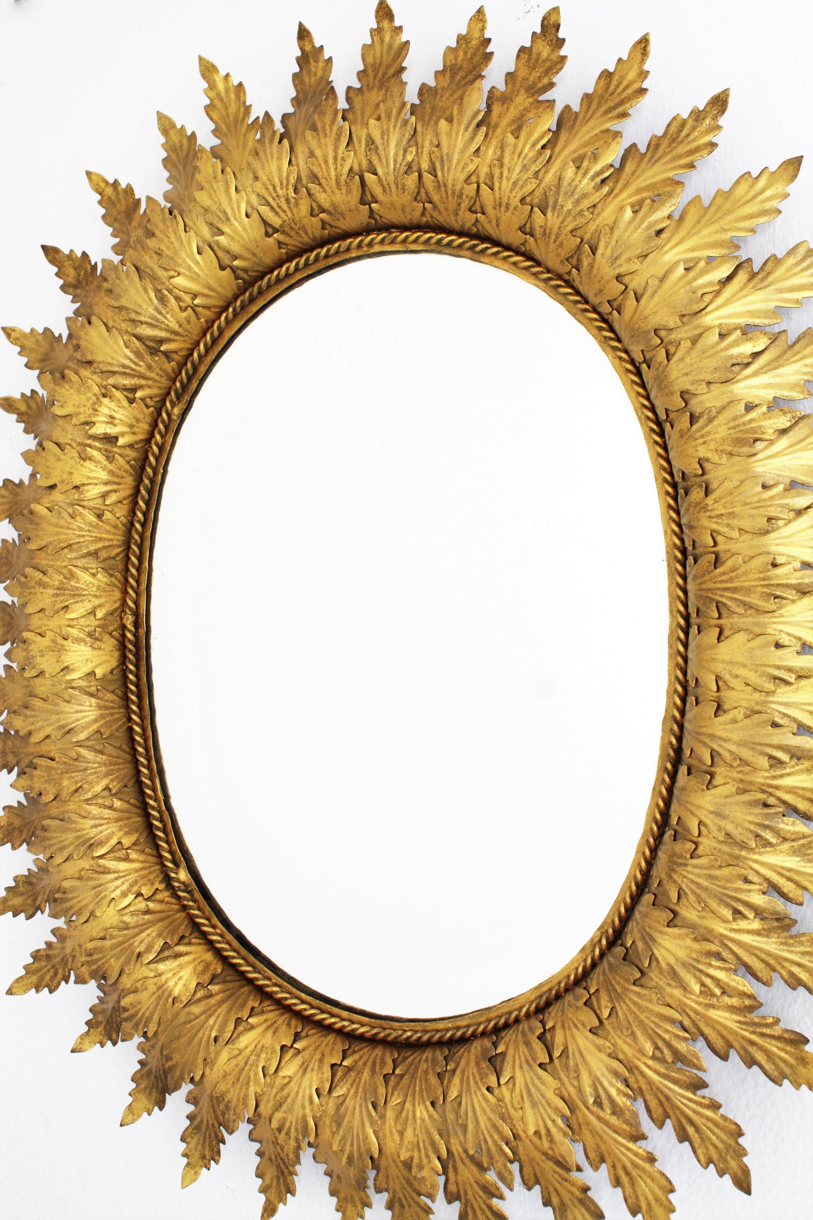 Hollywood Regency Oval Gilt Metal Leafed Sunburst Mirror, Spain, 1950s 2