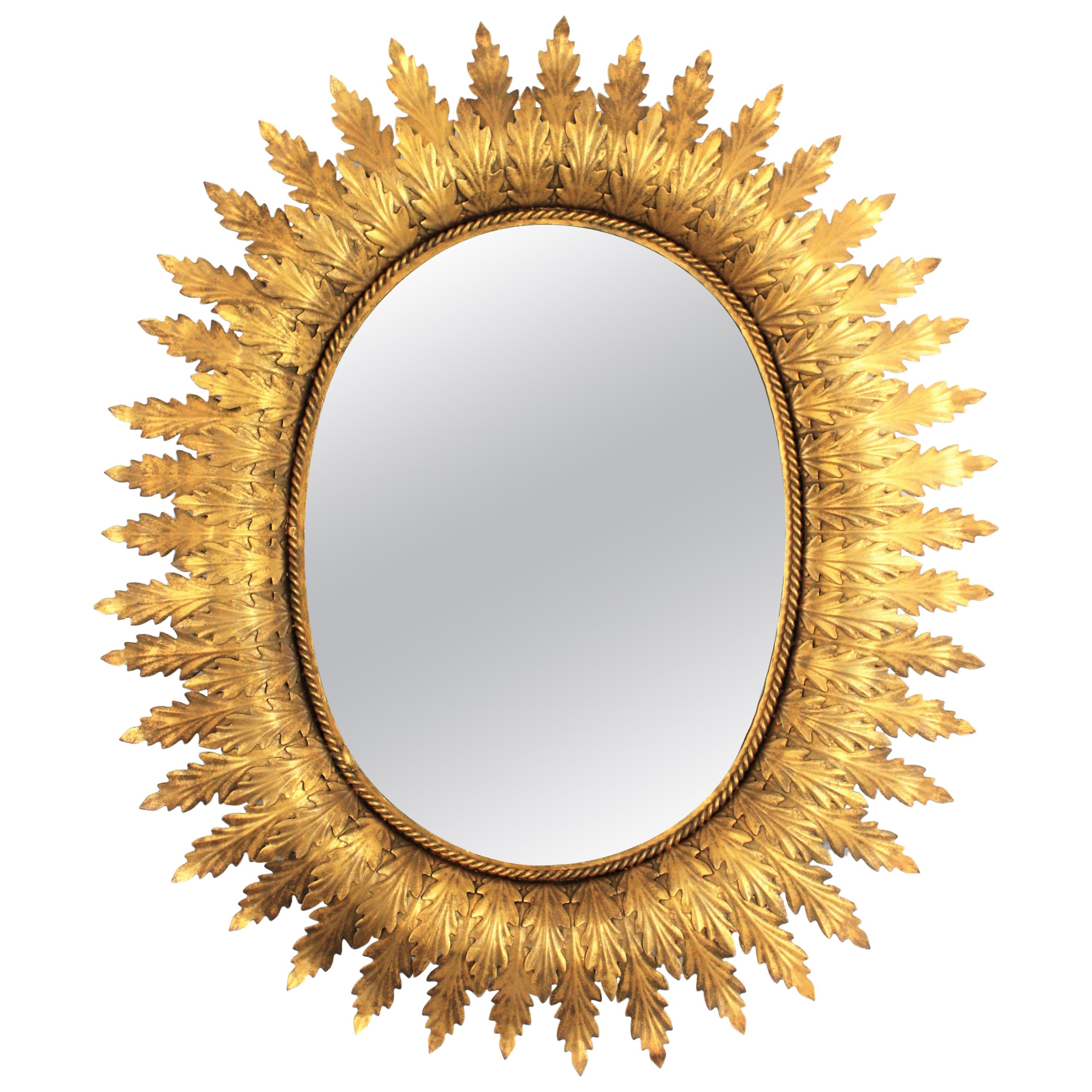 Hollywood Regency Oval Gilt Metal Leafed Sunburst Mirror, Spain, 1950s