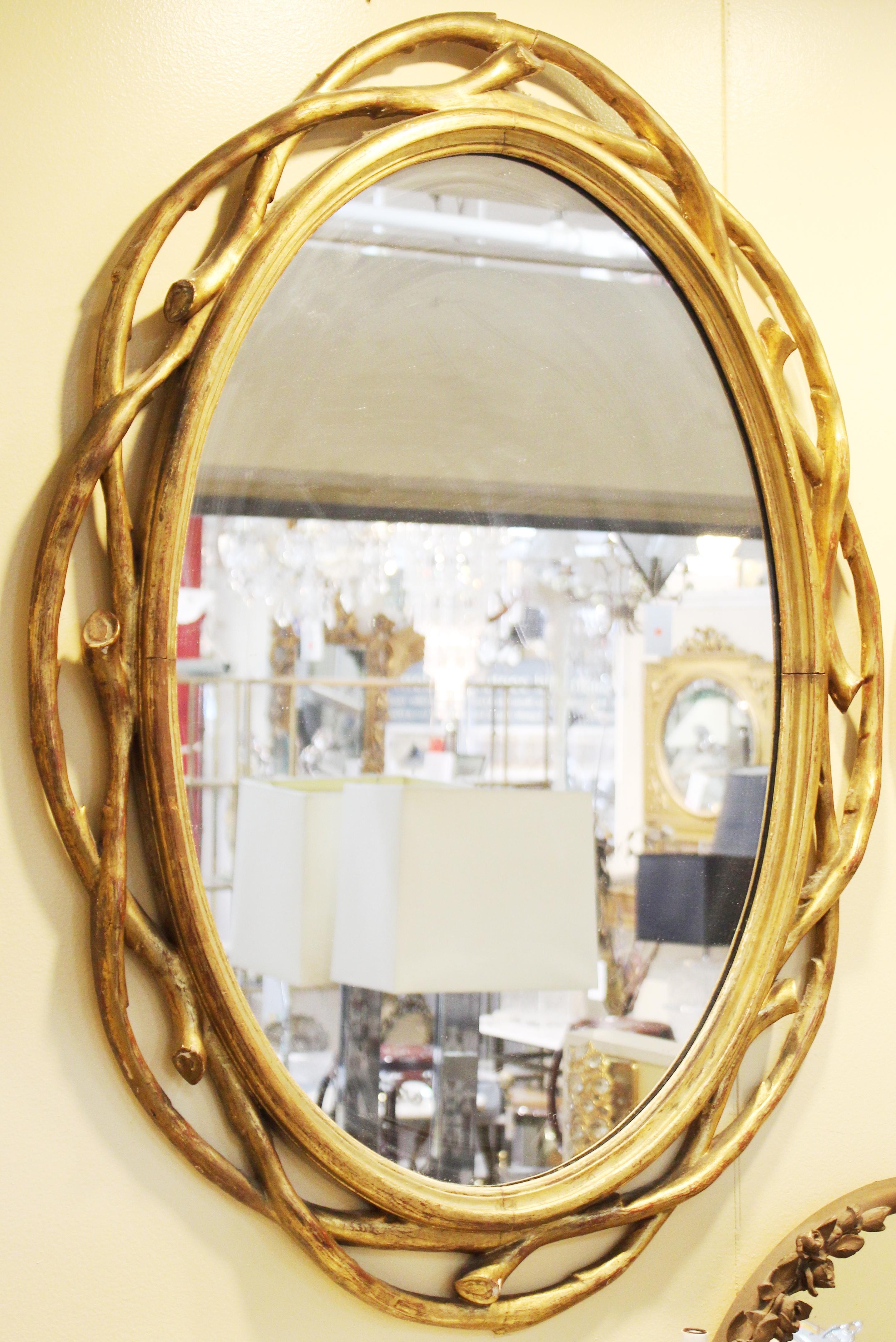 Hollywood Regency Oval Mirrors with Carved Giltwood Frame In Good Condition In New York, NY