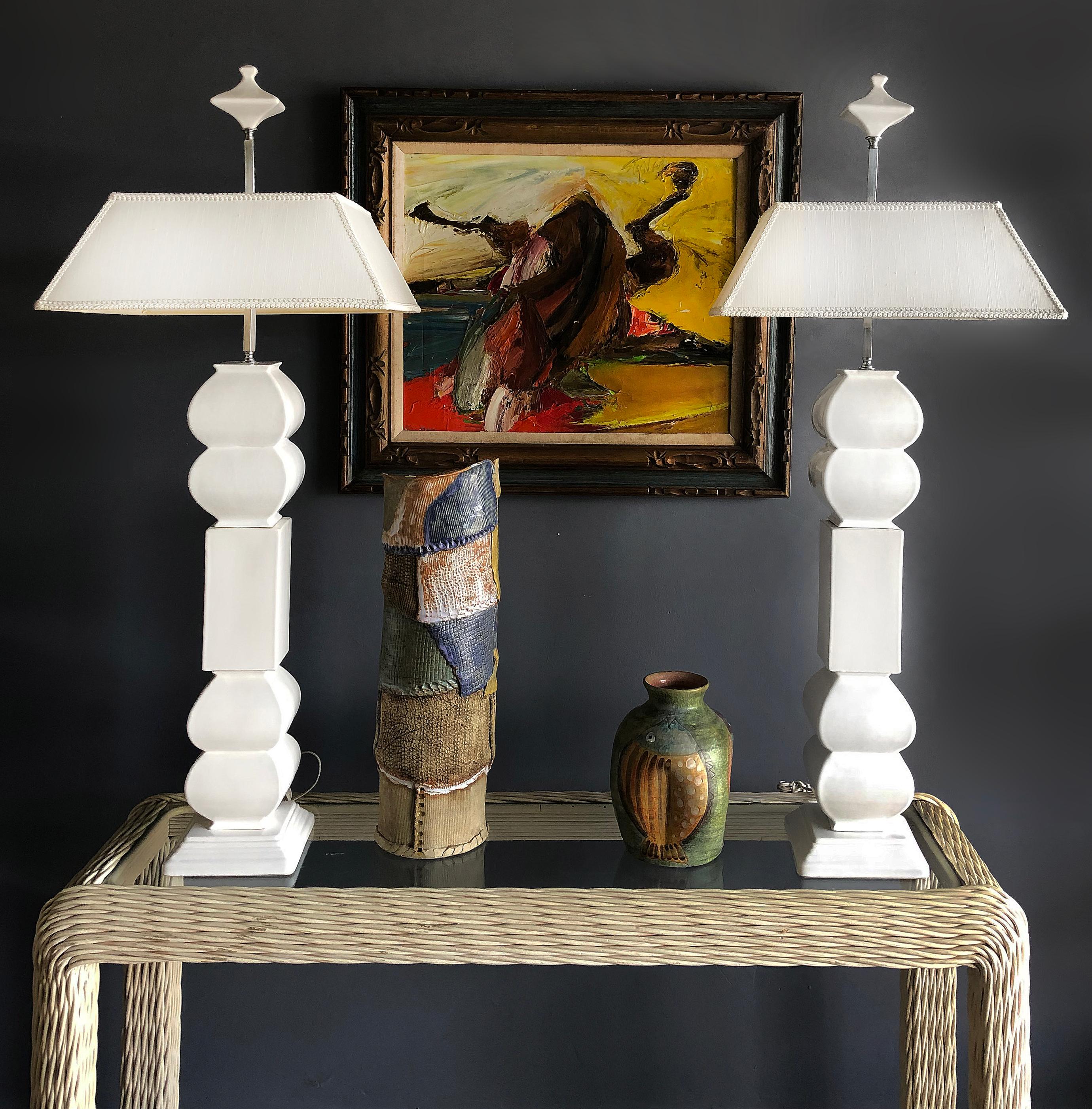Hollywood Regency overscale ceramic table lamps, pair

Offered for sale is a pair of oversized vintage Hollywood Regency table lamps with sculptural ceramic bodies and matching finials. The shades have been recovered and the lamps are in working