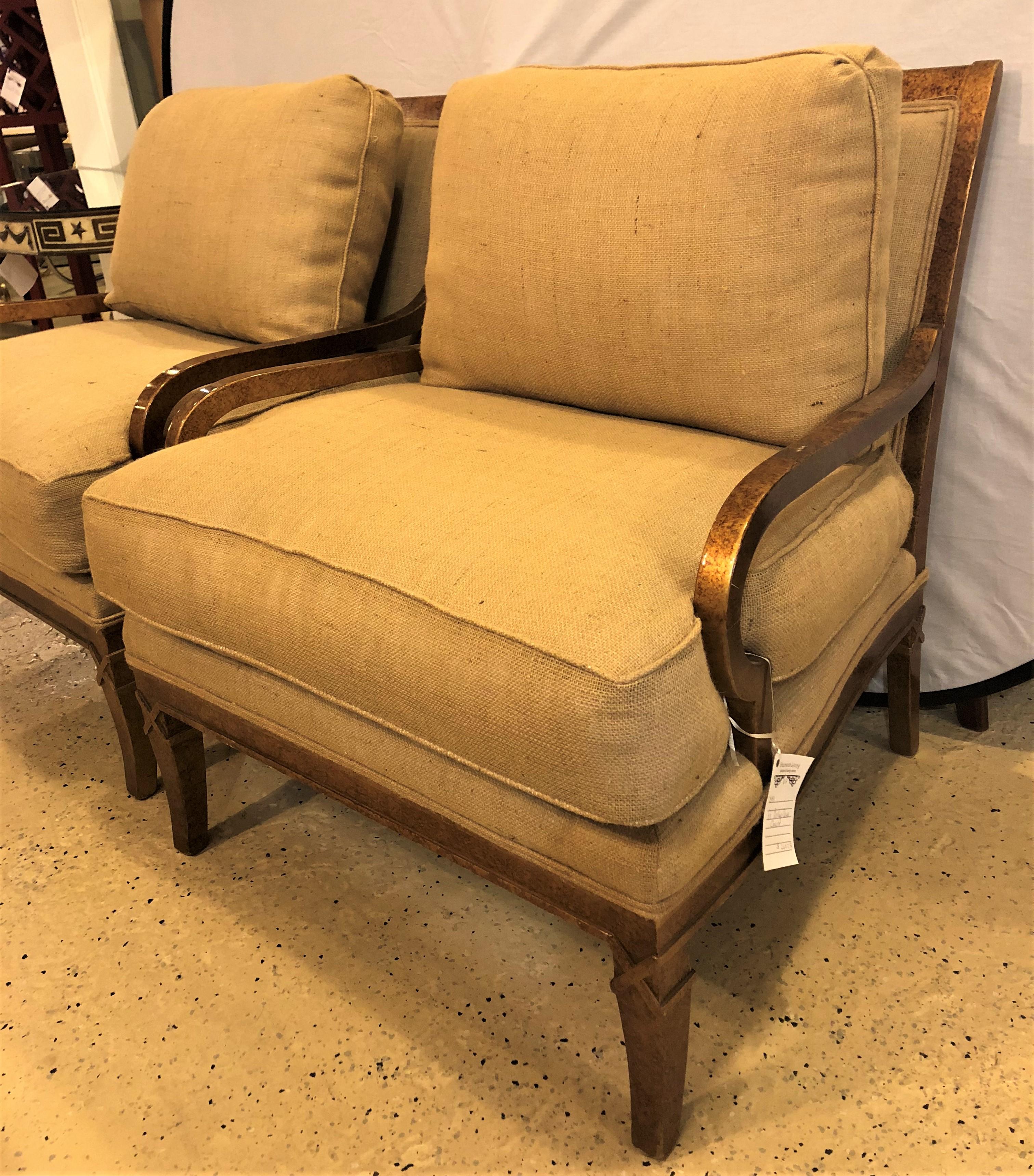 Pair of Burlap faux marbleized bergère or armchairs in the Hollywood Regency style. These very stylish and sleek lounge chairs with their X-form leg tops are certain to add class and elegance to any room in the home or office. Strong, clean and