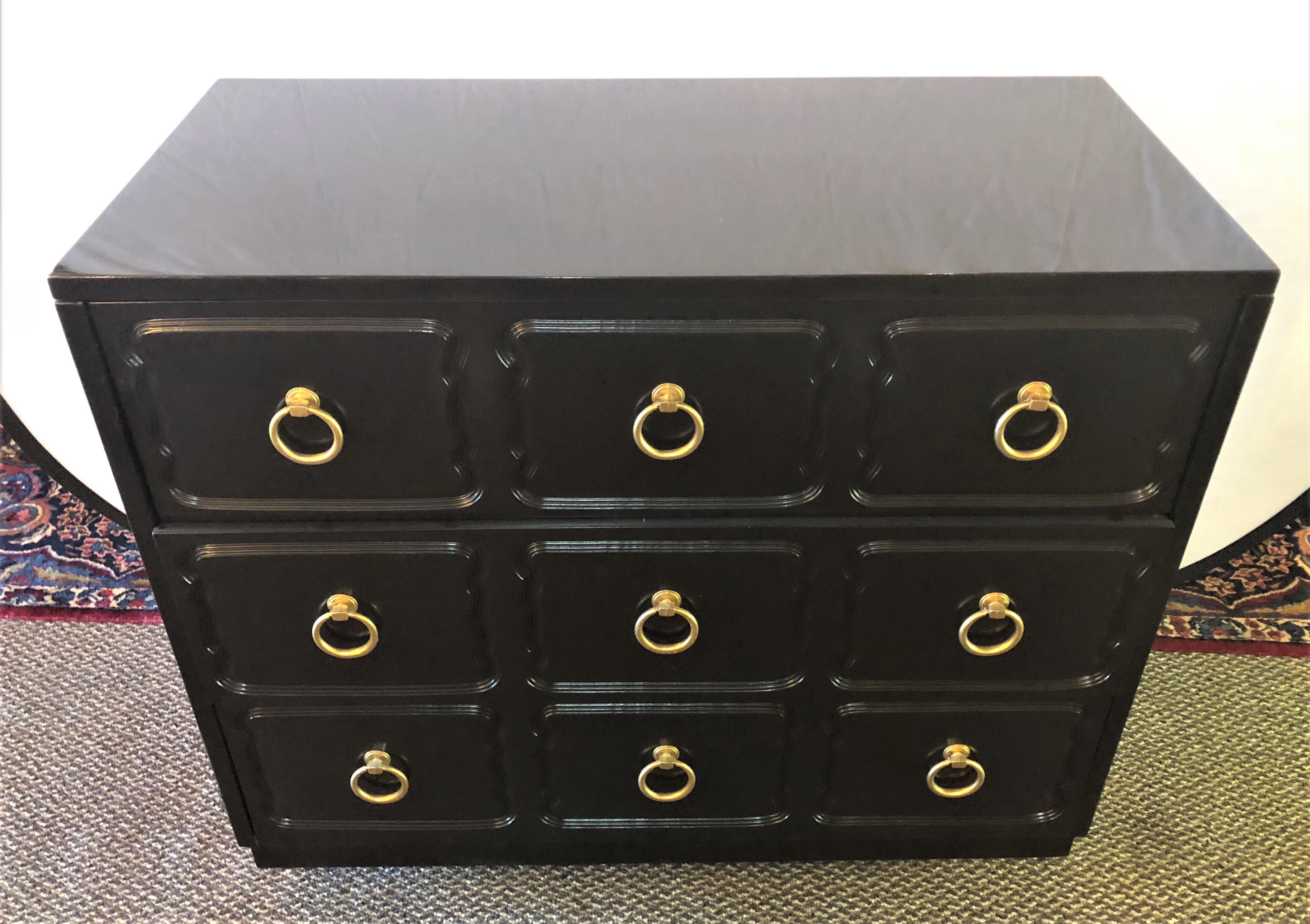 A pair of ebony refinished Dorothy Draper style chests or commodes or nightstands. These fully refinished chests are spectacular and stylish to say the least. Hollywood Regency never looked so good. Typically these chests would have the gilt around