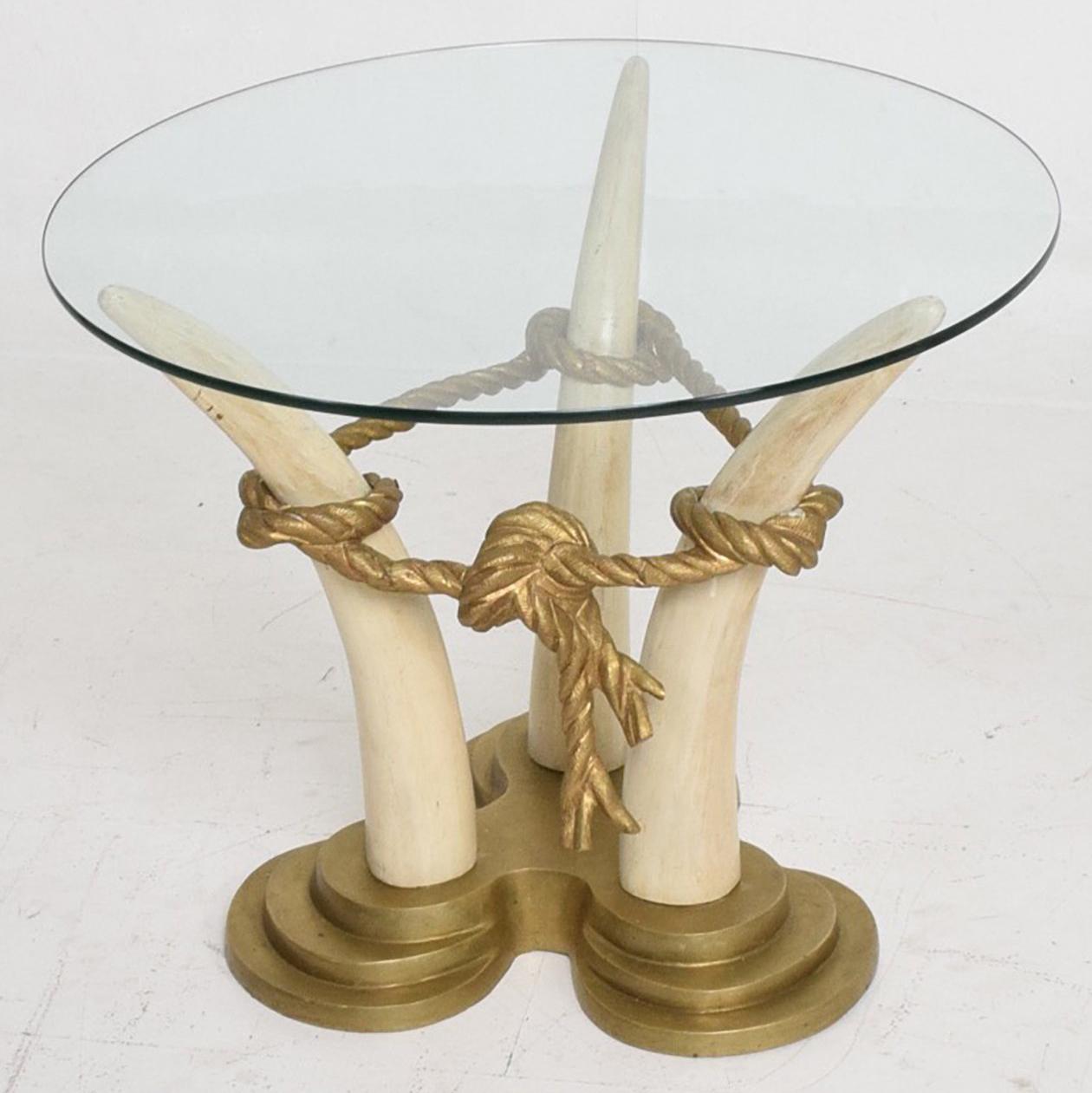 For your consideration a pair of side tables in bronze and faux ivory with glass tops.

By Valenti, Spain
22 1/2