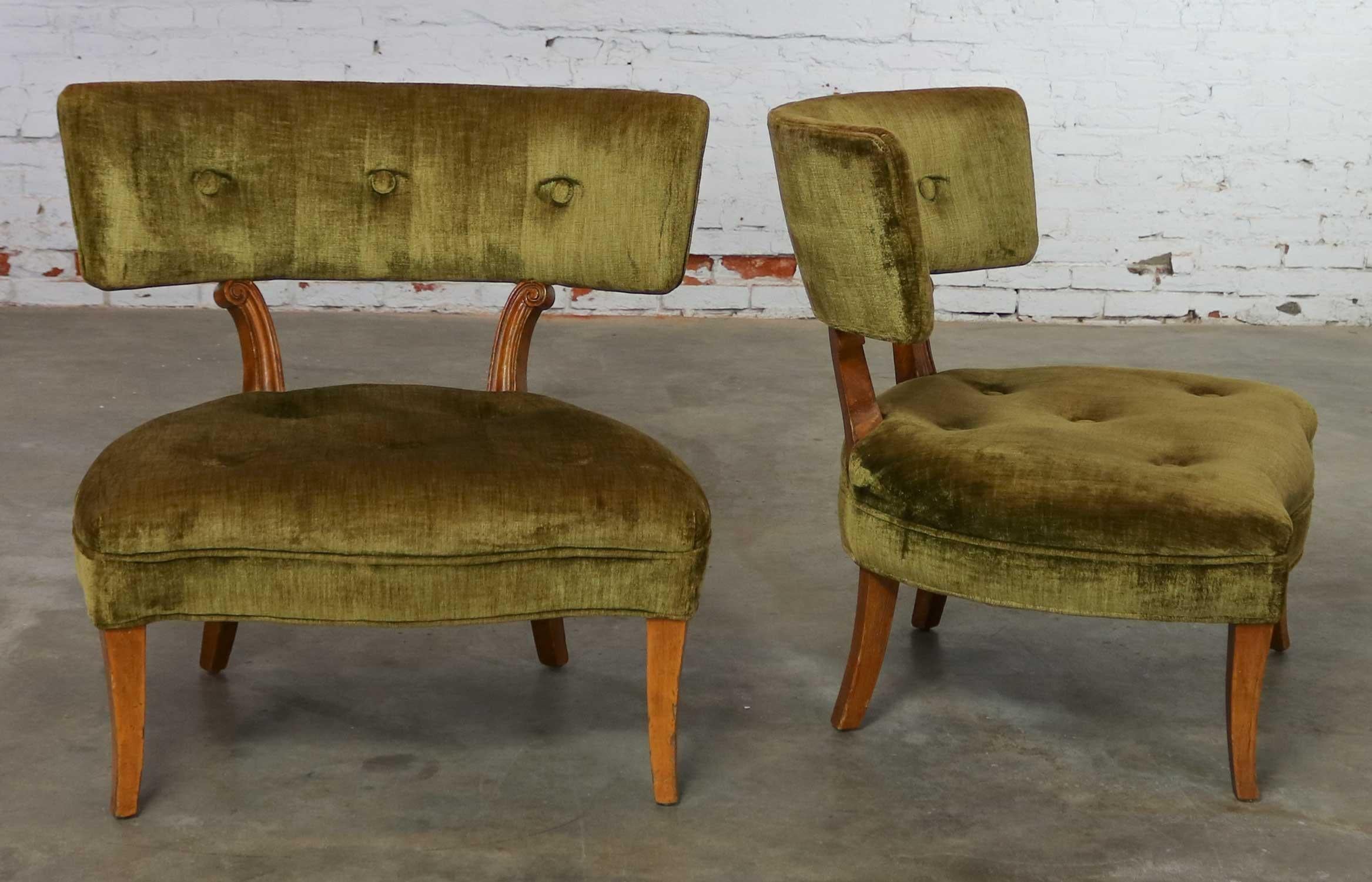 Lovely pair of Hollywood Regency or Transitional Modern slipper chairs in the style of Lorin Jackson for Grosfeld House. Moss green velvet upholstery and curved wood legs. They are in wonderful vintage original condition with perfectly aged patina.