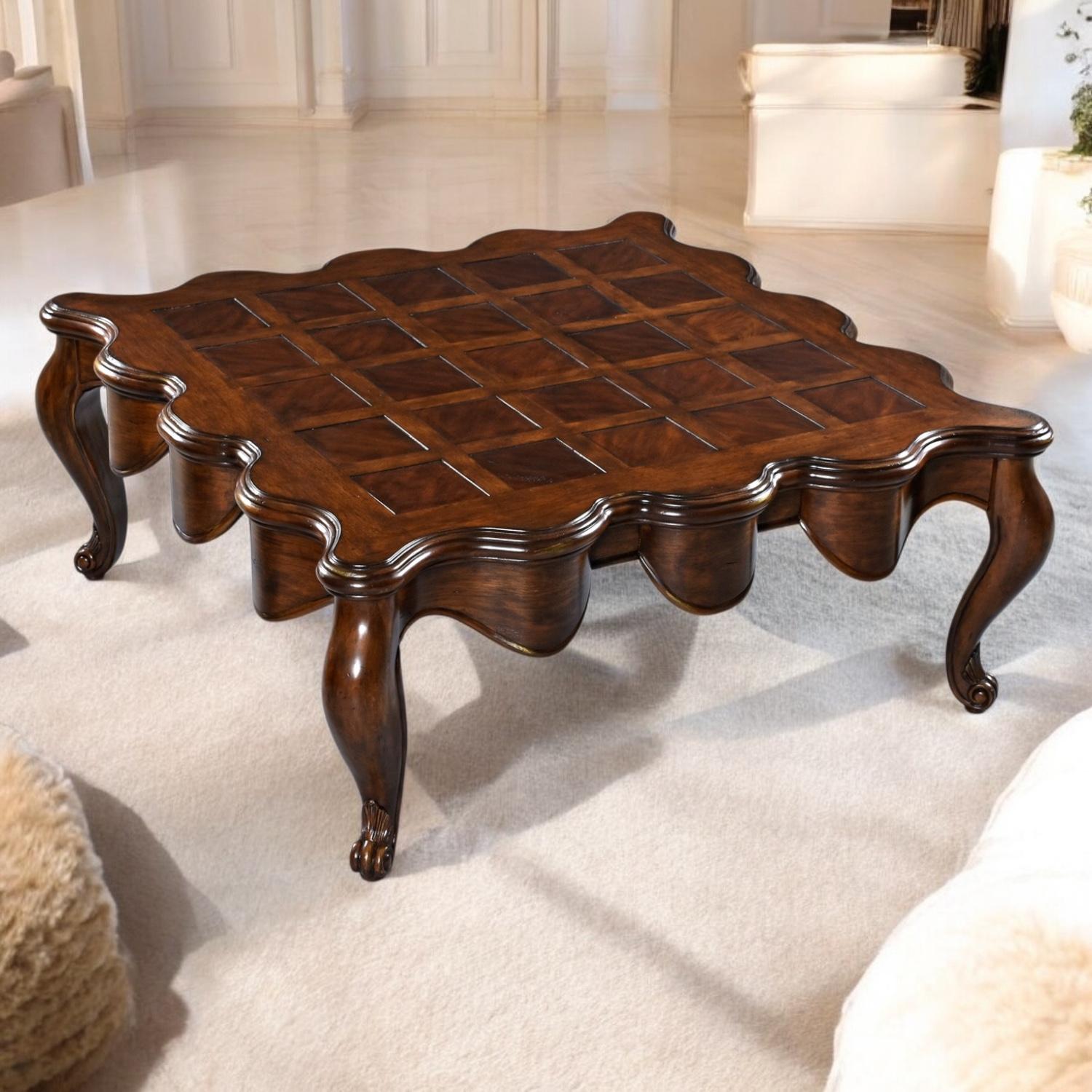 Exuding lavish mid-century drama, this coffee table presents a hypnotic tableau of Southern craftsmanship and Hollywood Regency flair. Its scalloped-edge tabletop features an intricate parquet design of richly varnished cherry—or variable mahogany