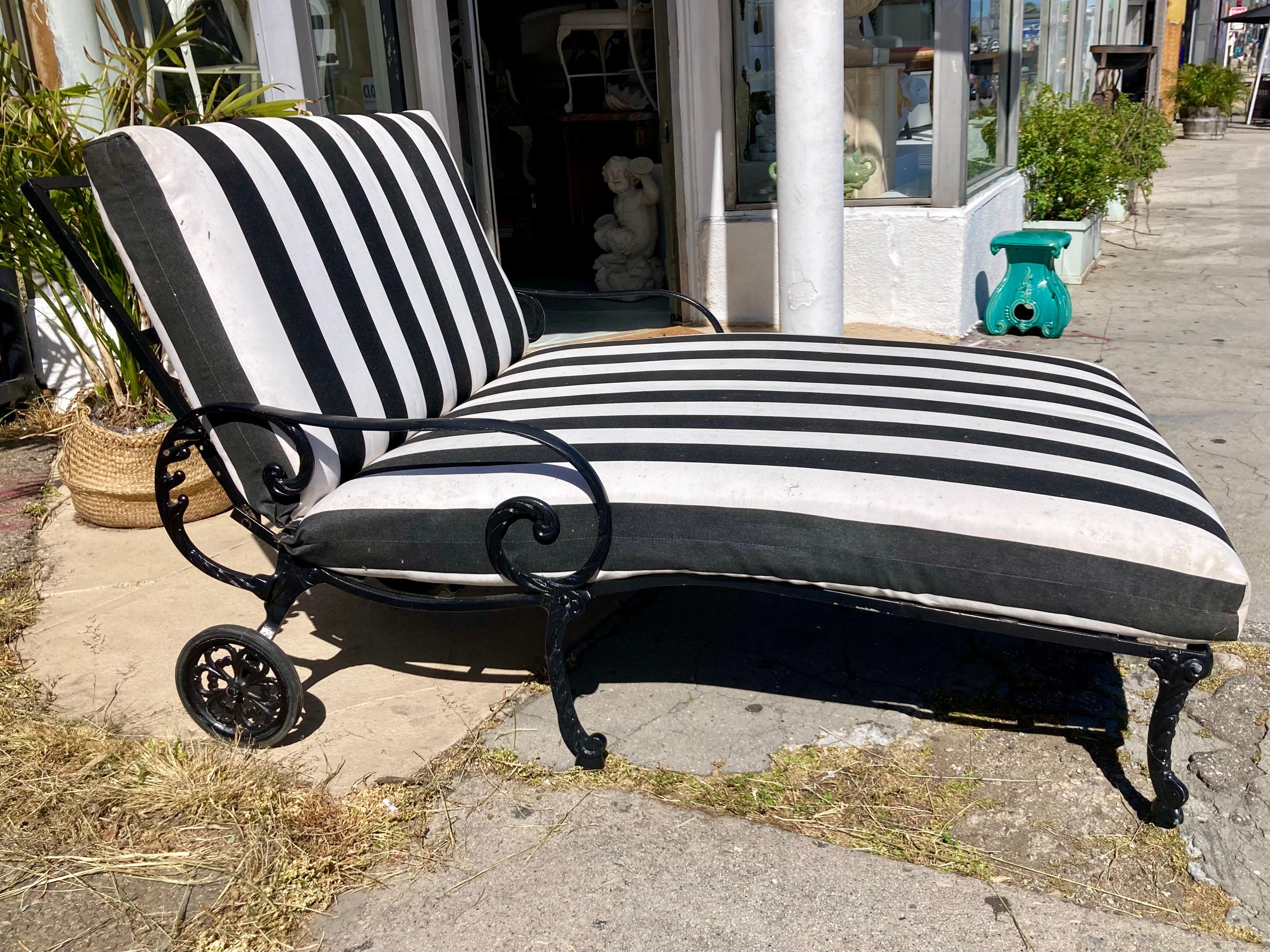 Beautiful Hollywood Regency patio double chaise for 2 persons with cushions. Great addition to your patio and outdoors. Black and white Sunbrella fabric on cushion, so easy to add other pieces with same fabric. We specialize in this Hollywood