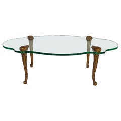 Hollywood Regency P.E. Table basse ovale en bois doré et verre de style Guérin