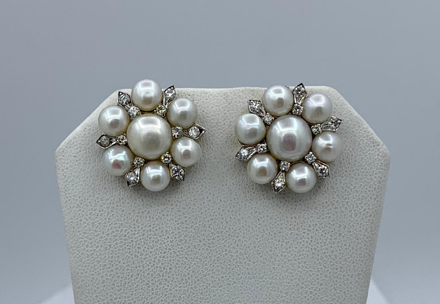 A gorgeous pair of antique Pearl and 24 Diamond Earrings in 14 Karat White Gold.  The Retro Hollywood Regency jewels are beautiful and we have the matching 3 strand Pearl Necklace in another listing.  The Pearls are stunning with beautiful nacre and