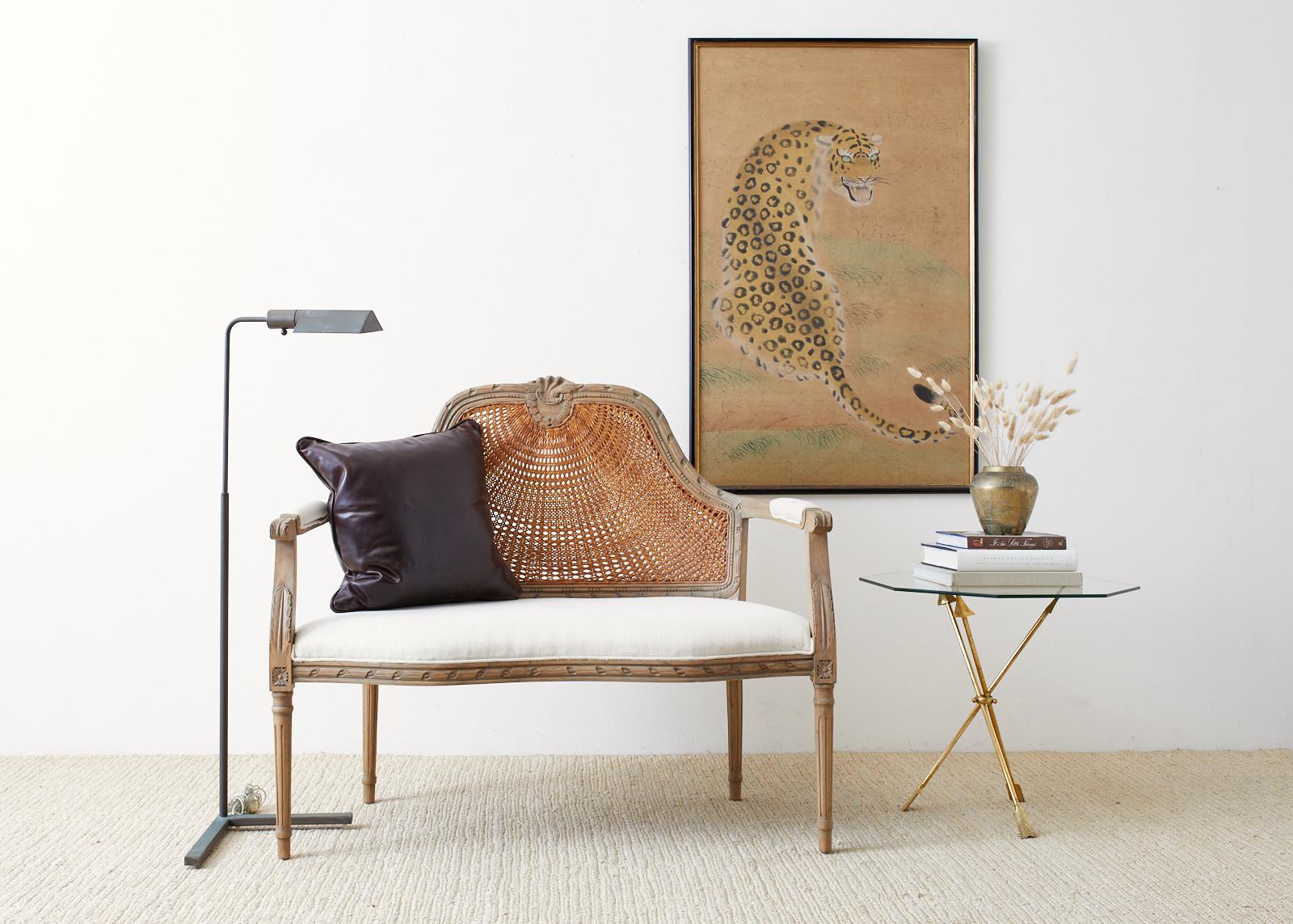 Fantastic Japanese ink and color painting of a leopard on handcrafted mulberry paper, 1970s Hollywood Regency period from Bloomingdale's Home Studio private collection with original tags still attached. Mounted on board and set in an ebonized frame