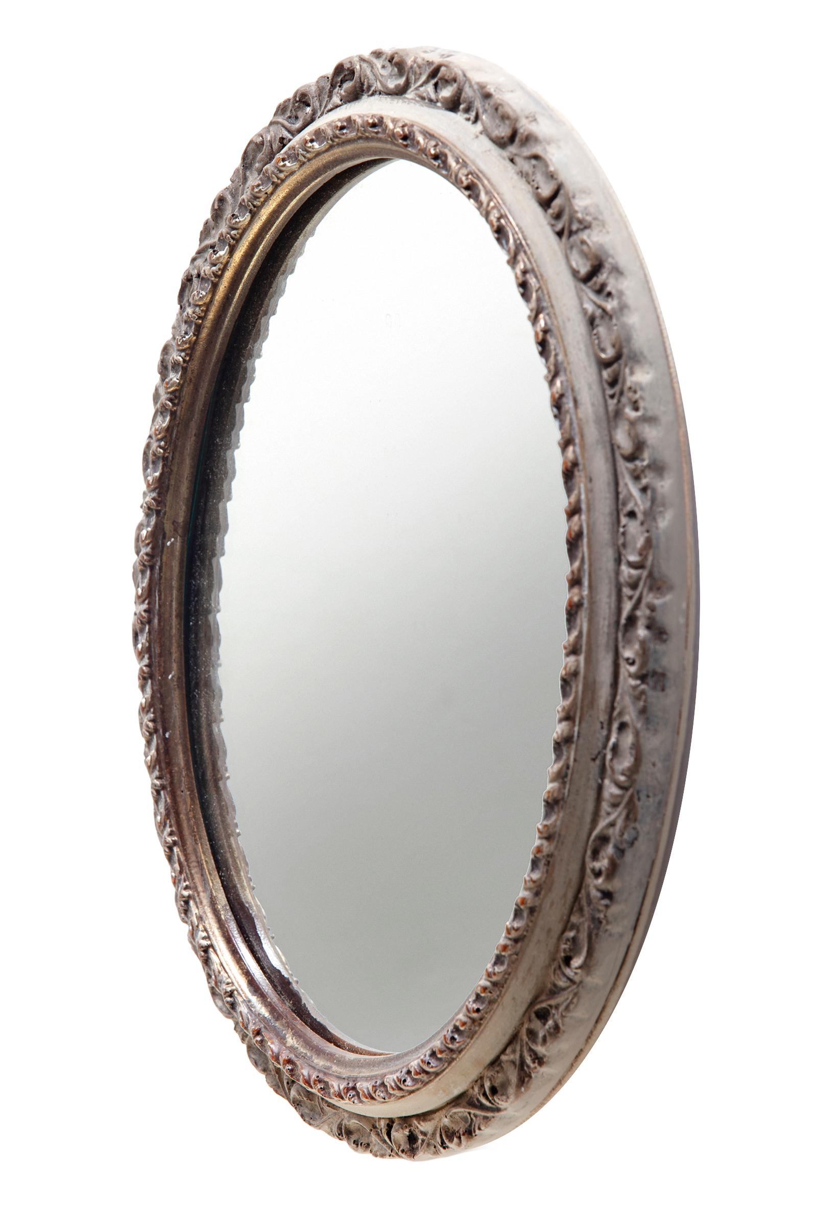 Pretty little French style oval mirror with aged finish over a dark gilding.
New backing, wired to hang both ways.