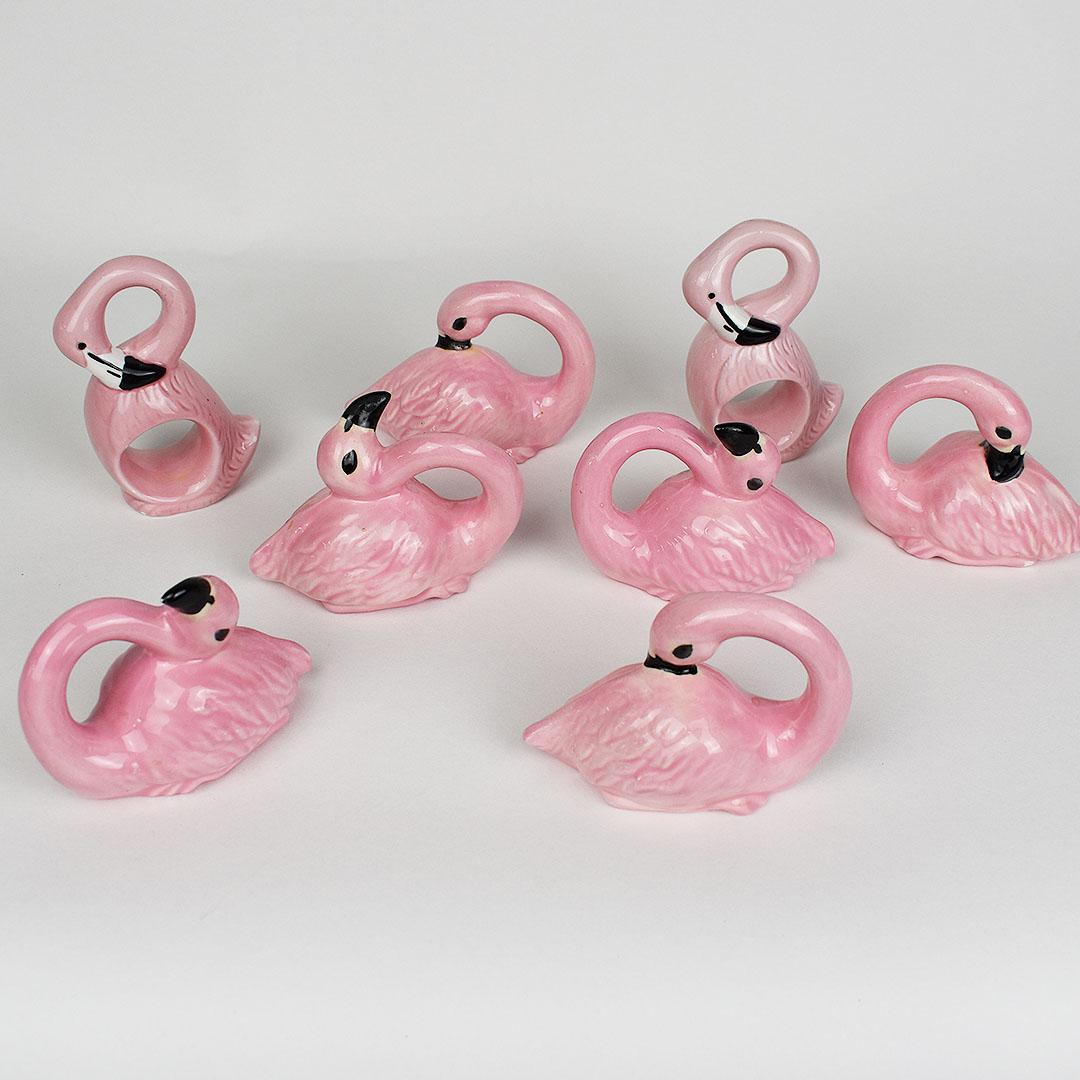 Set of 8 pink ceramic flamingo napkin rings in pink, white and black. A fabulous way to add a bit of whimsy to a summer supper table. Flamingos are in various poses and range in size. 

Dimensions:
3-3.5