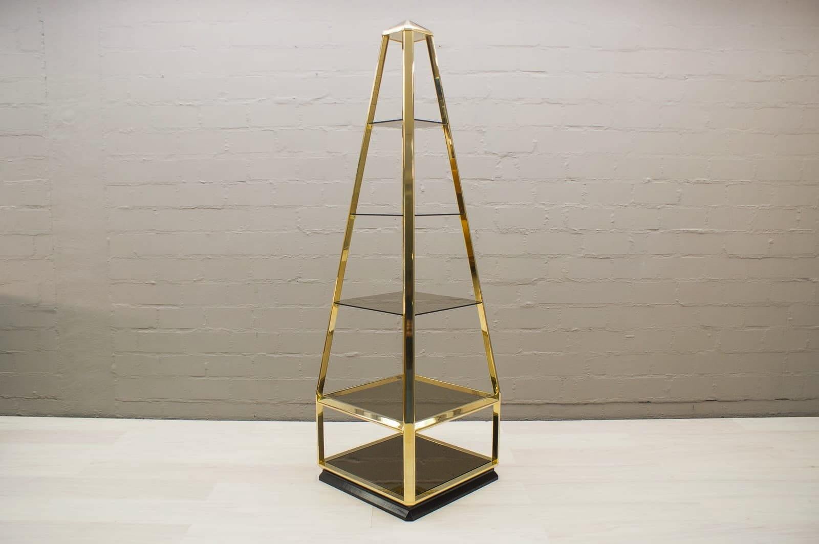 This shelving unit features a golden brass frame, smoked glass shelves, and a black-lacquered, removable base.

Was bought by the previous owner in France in the 1970s.


 