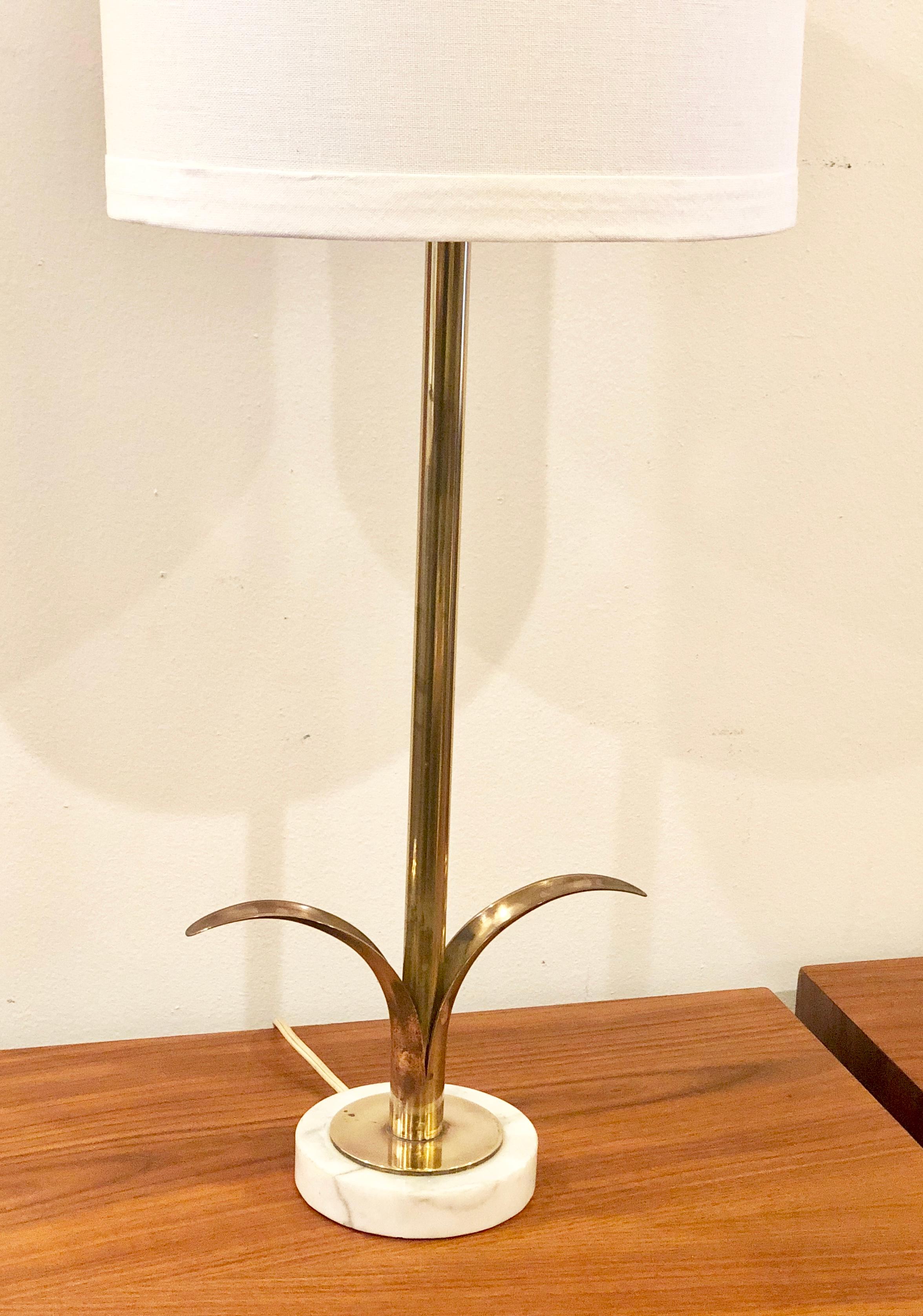 Beautiful and rare solid polished brass table lamp by Ystad of Sweden, sitting on a marble base 2way lamp in perfect working condition lampshade its not included the lamp its 29